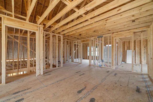 a view of a bedroom with balcony and door