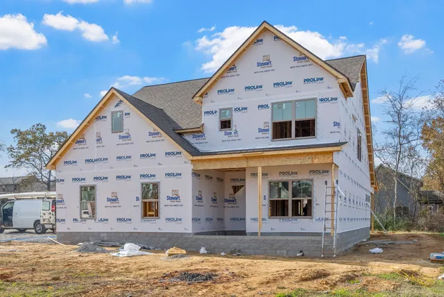 a view of a house with a street