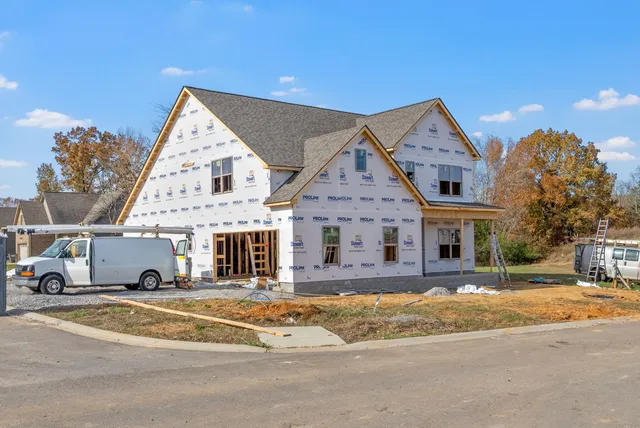 a view of a livingroom with furniture and windows