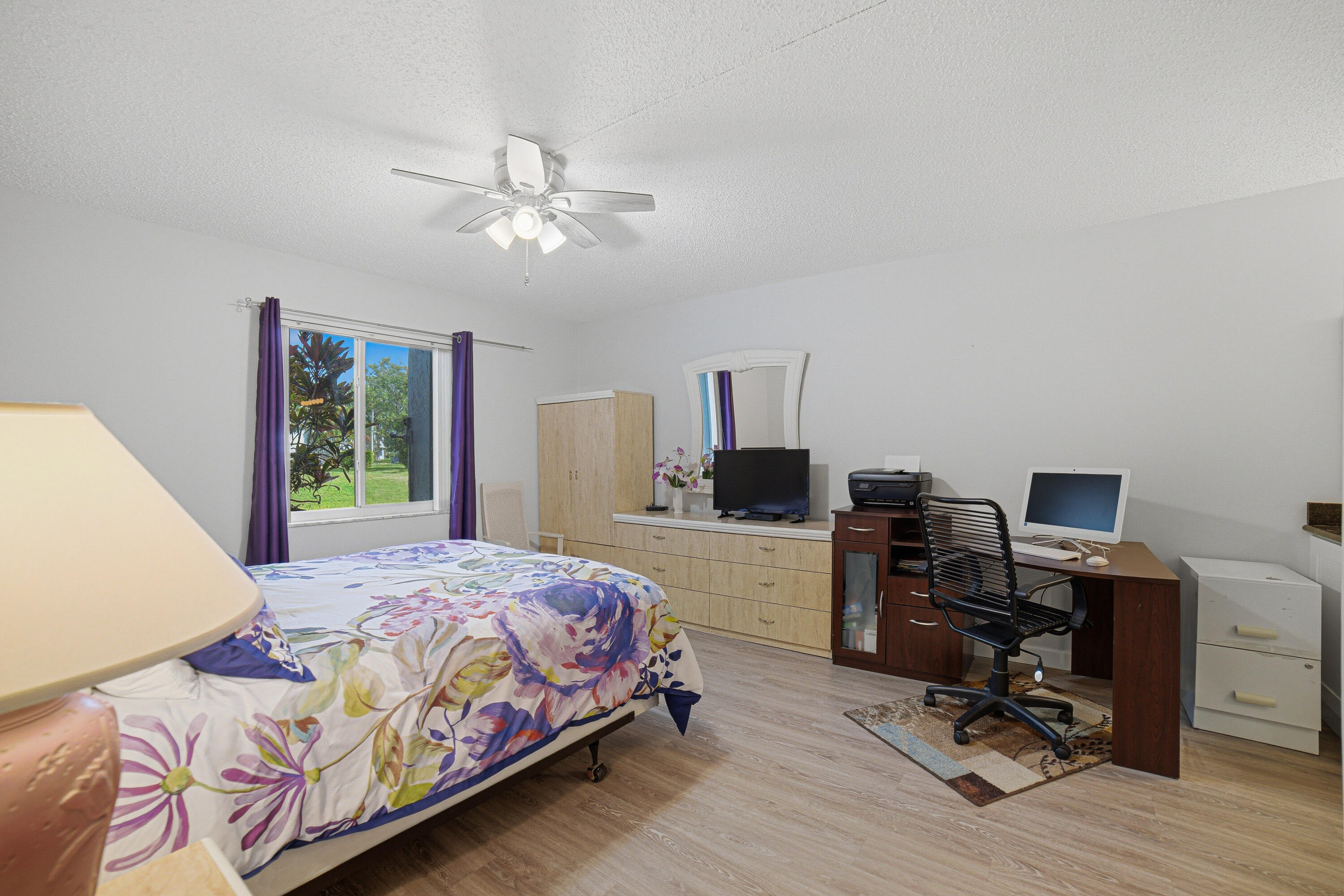 2901 Southwest 15th Street, Unit 102 Delray Beach, FL 33445 - Photo 15 of 59 a bedroom with a bed and a desk