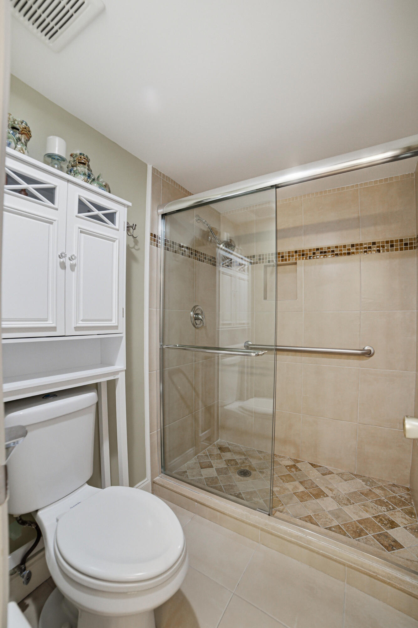2901 Southwest 15th Street, Unit 102 Delray Beach, FL 33445 - Photo 19 of 59 a bathroom with a toilet and a shower