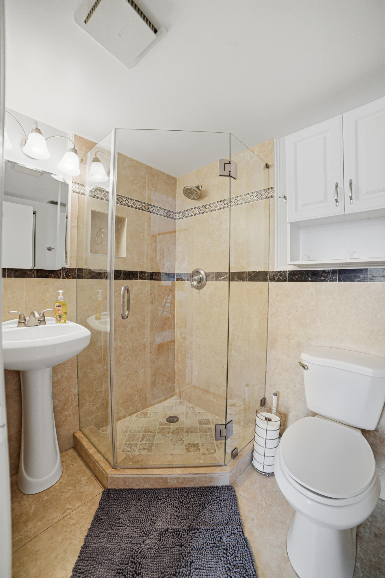 2901 Southwest 15th Street, Unit 102 Delray Beach, FL 33445 - Photo 23 of 59 a bathroom with a sink toilet and shower