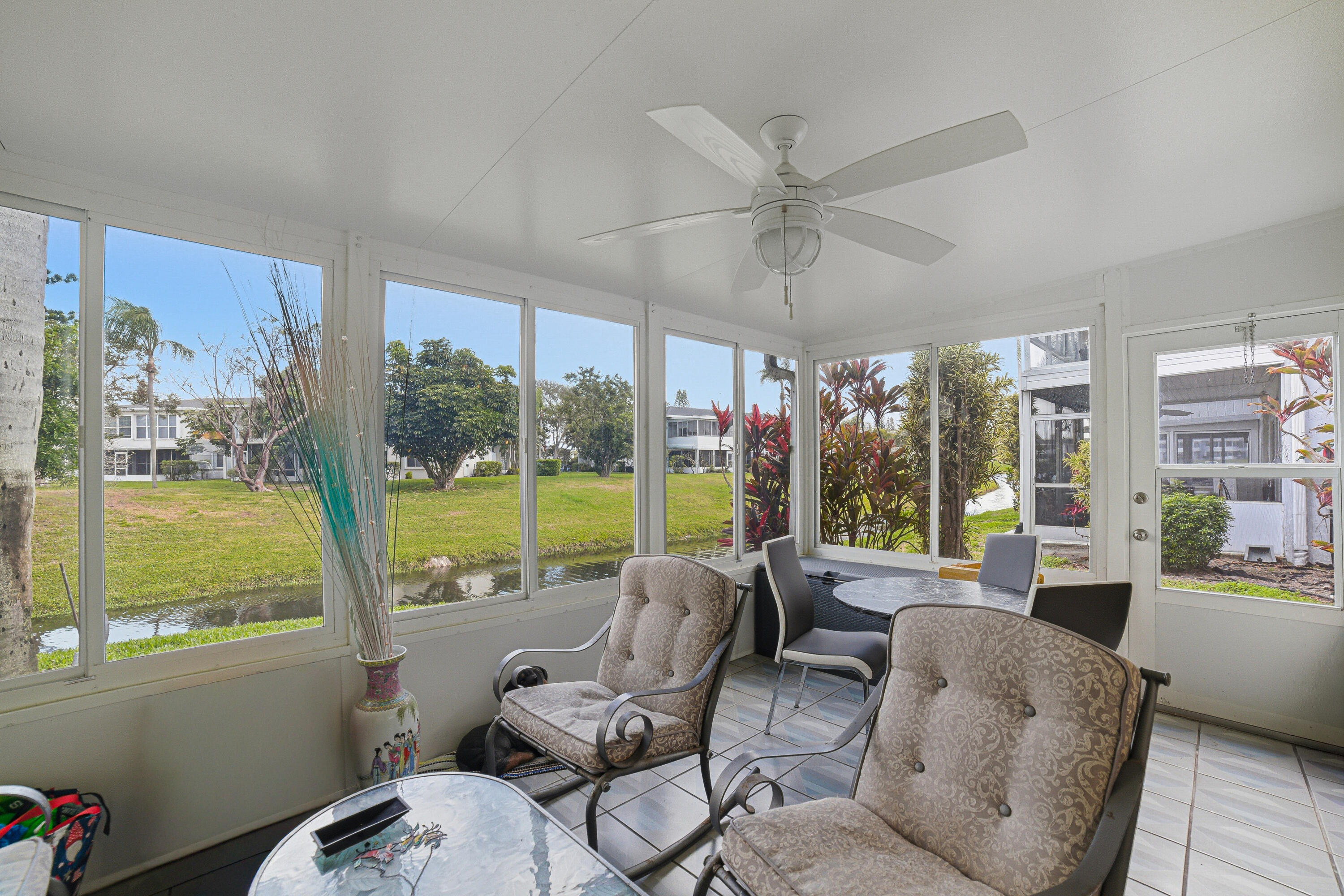 2901 Southwest 15th Street, Unit 102 Delray Beach, FL 33445 - Photo 25 of 59 a living room with furniture and a large window