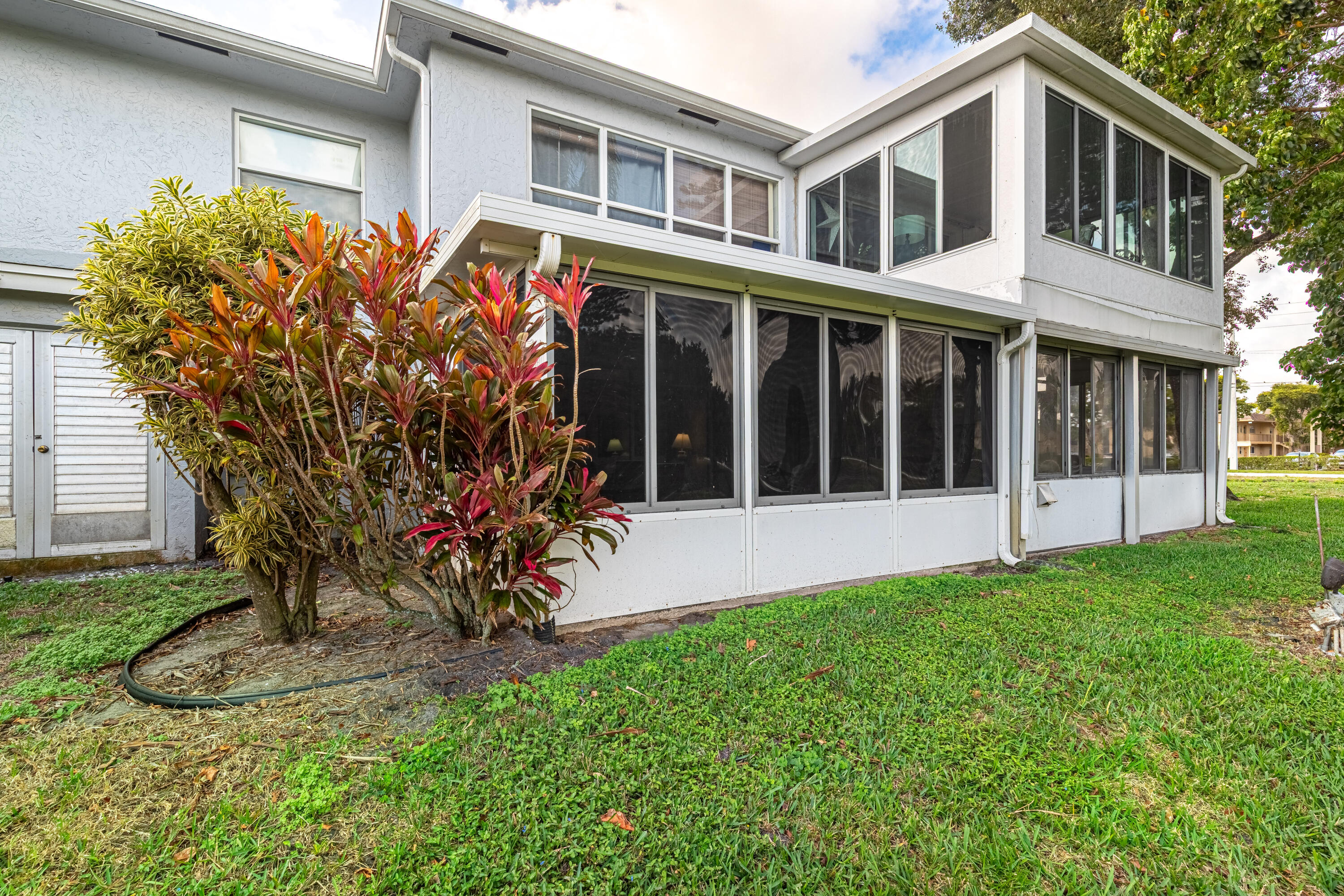 2901 Southwest 15th Street, Unit 102 Delray Beach, FL 33445 - Photo 29 of 59 a view of a house with a yard