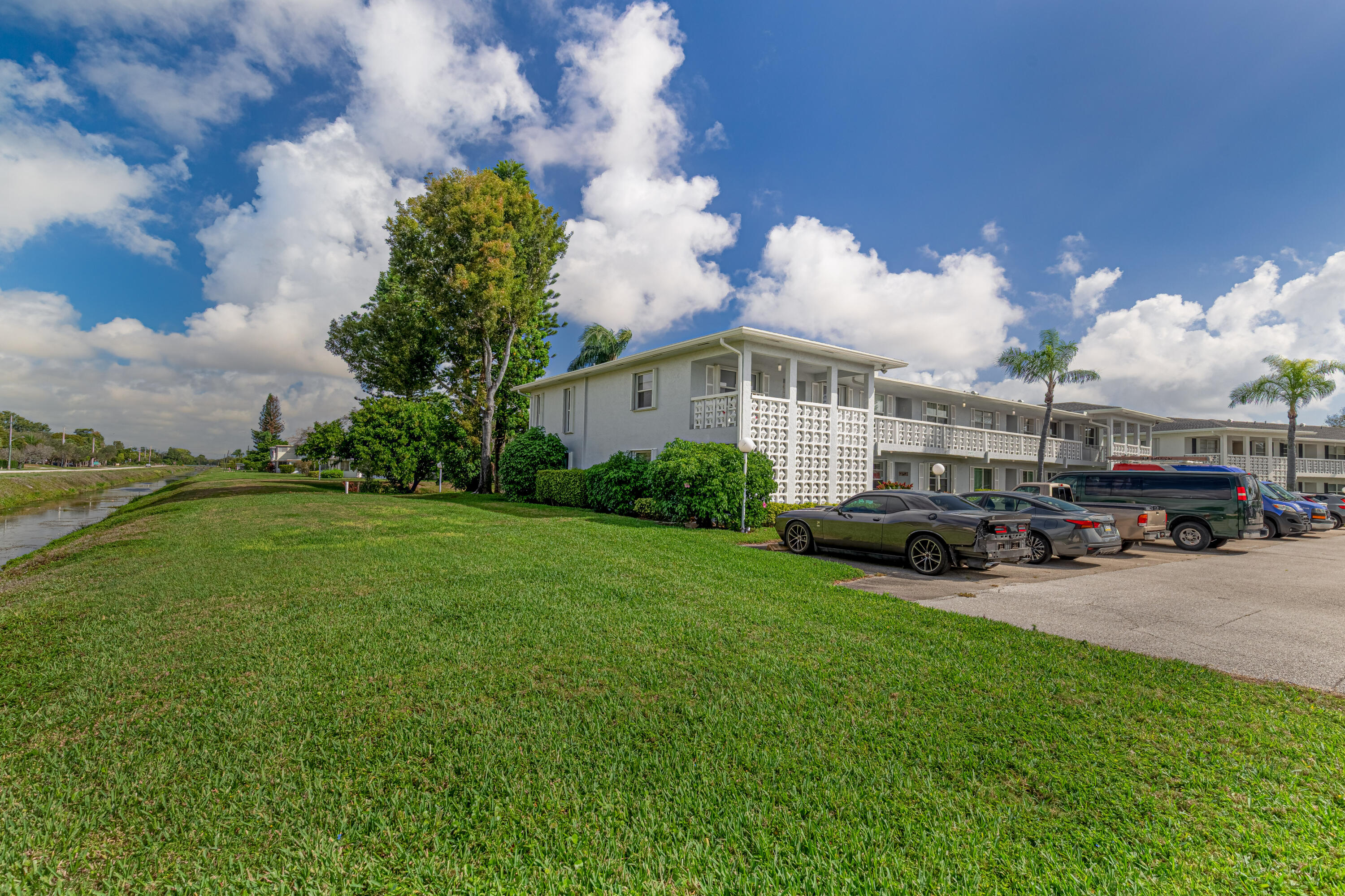 2901 Southwest 15th Street, Unit 102 Delray Beach, FL 33445 - Photo 3 of 59 a view of a house with a back yard