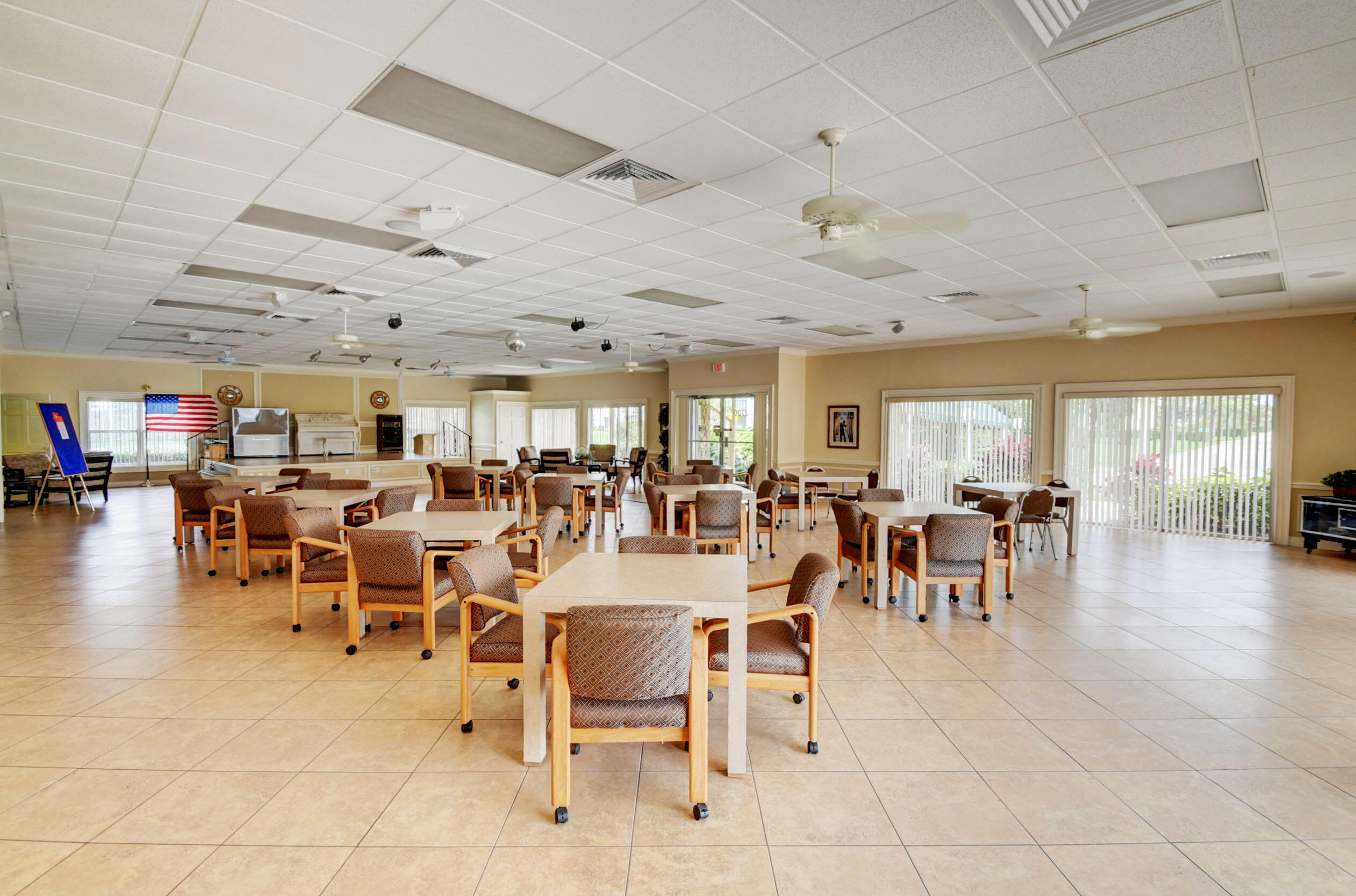 2901 Southwest 15th Street, Unit 102 Delray Beach, FL 33445 - Photo 36 of 59 an outdoor space with lots of furniture and lots of tables
