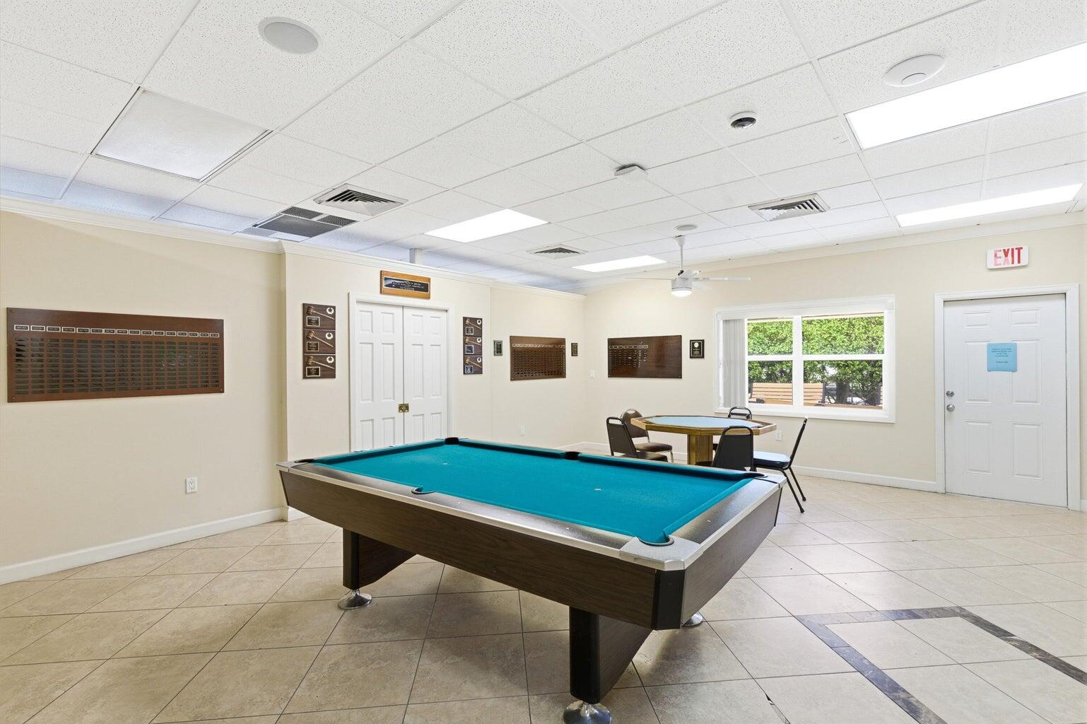 2901 Southwest 15th Street, Unit 102 Delray Beach, FL 33445 - Photo 40 of 59 a room with pool table and windows
