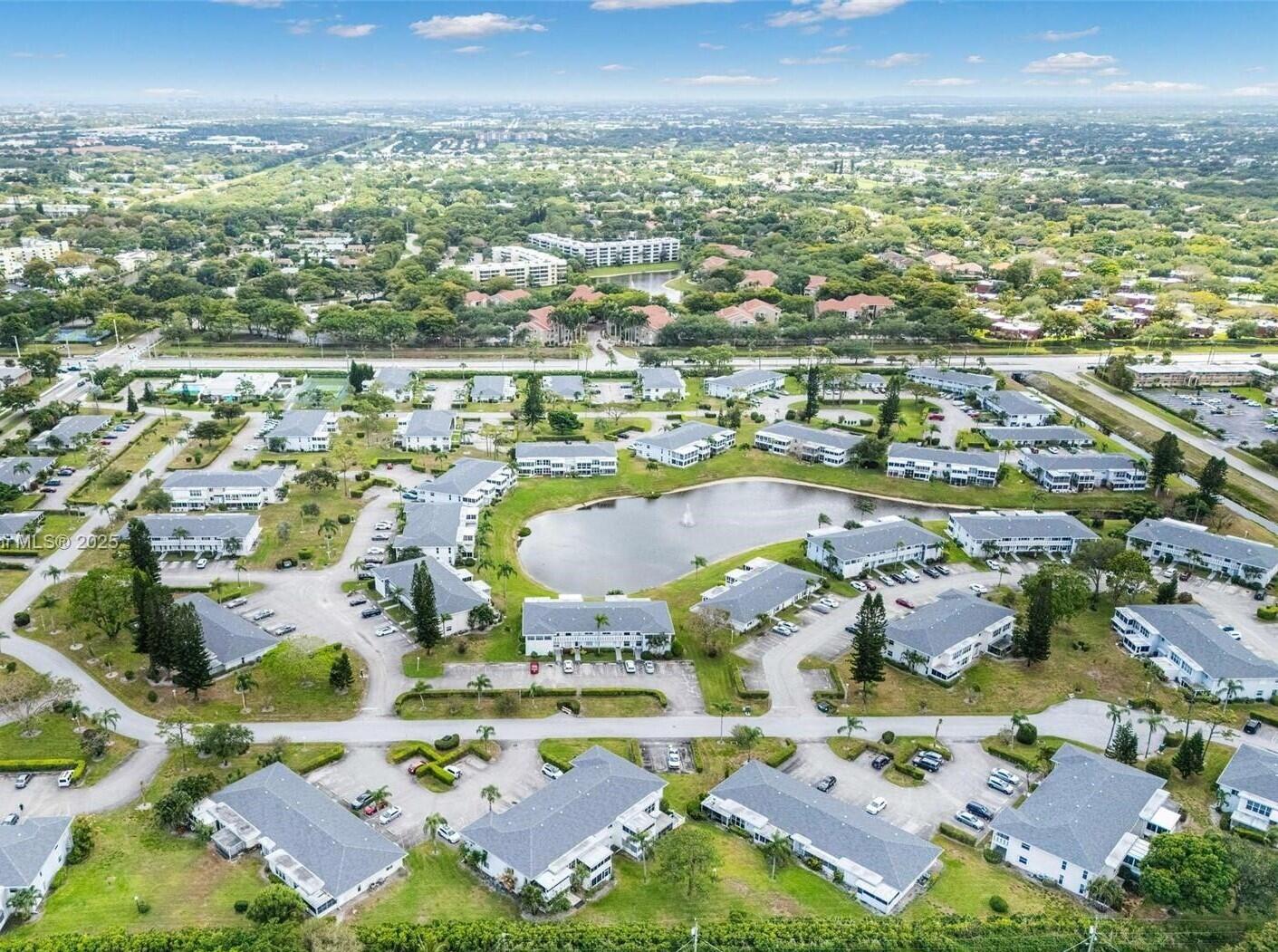 2901 Southwest 15th Street, Unit 102 Delray Beach, FL 33445 - Photo 48 of 59 an aerial view of residential houses with outdoor space
