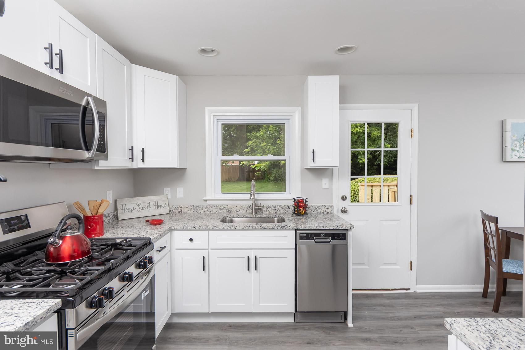461 Doris Circle Aberdeen, MD 21001 - Photo 18 of 35 a kitchen with stainless steel appliances white cabinets and stove top oven