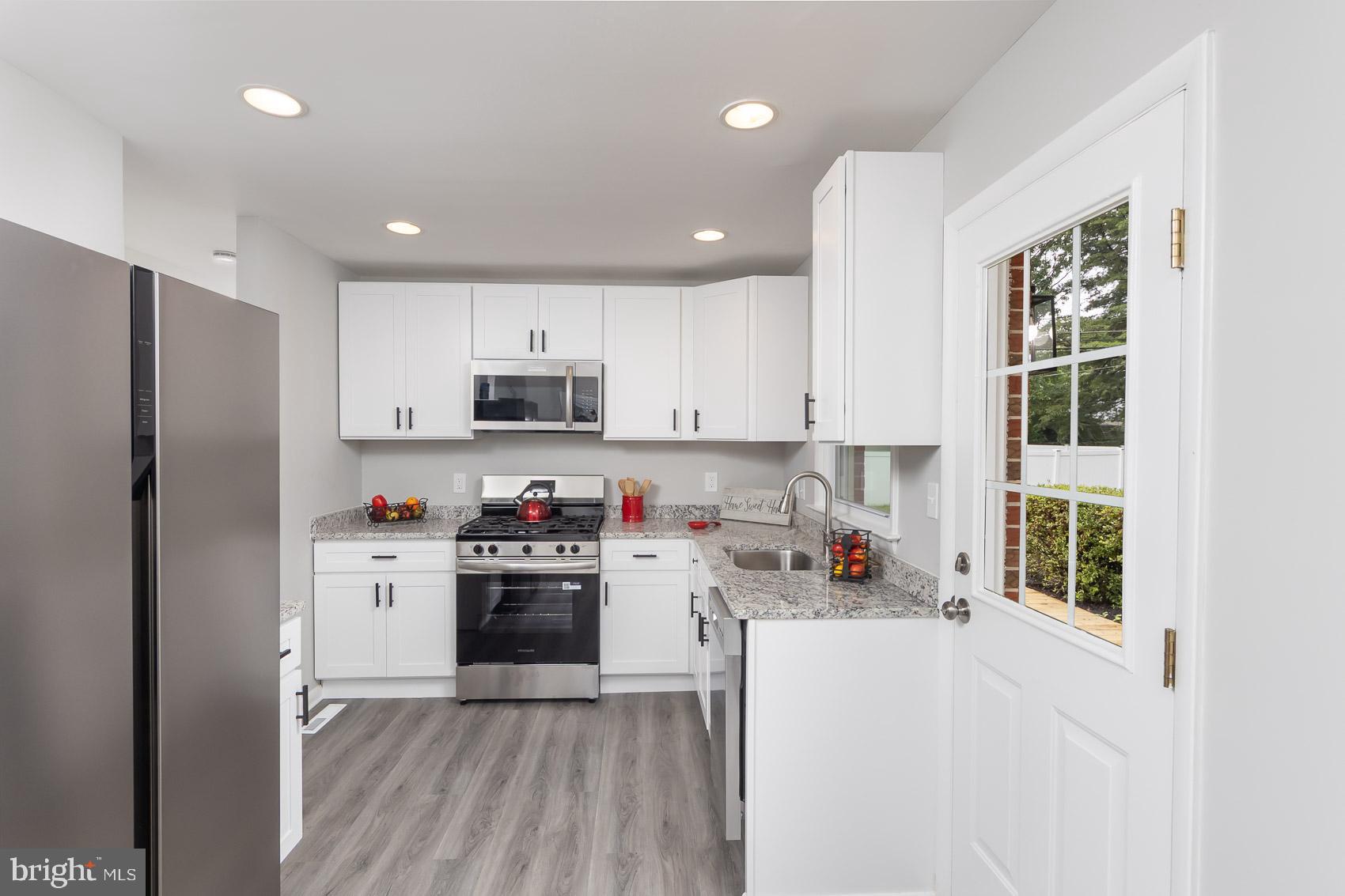 461 Doris Circle Aberdeen, MD 21001 - Photo 21 of 35 a kitchen with stainless steel appliances a refrigerator and a stove top oven