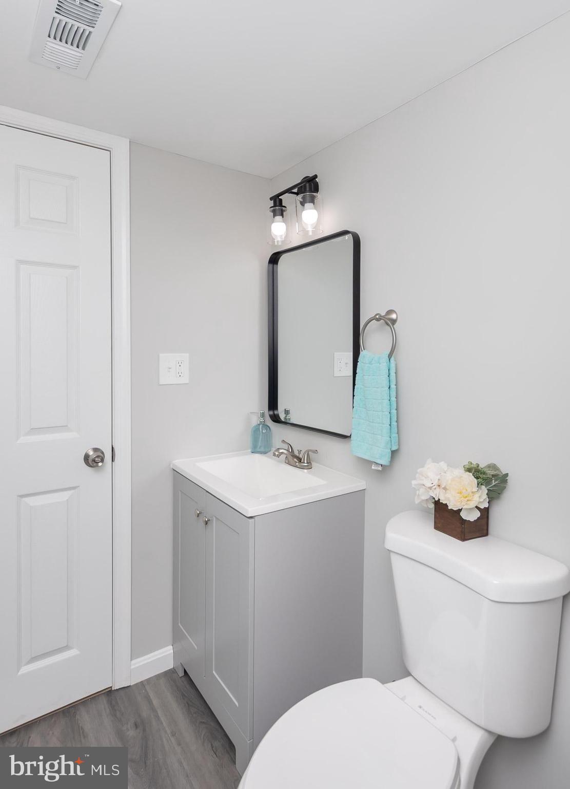 461 Doris Circle Aberdeen, MD 21001 - Photo 28 of 35 a bathroom with a toilet sink and mirror