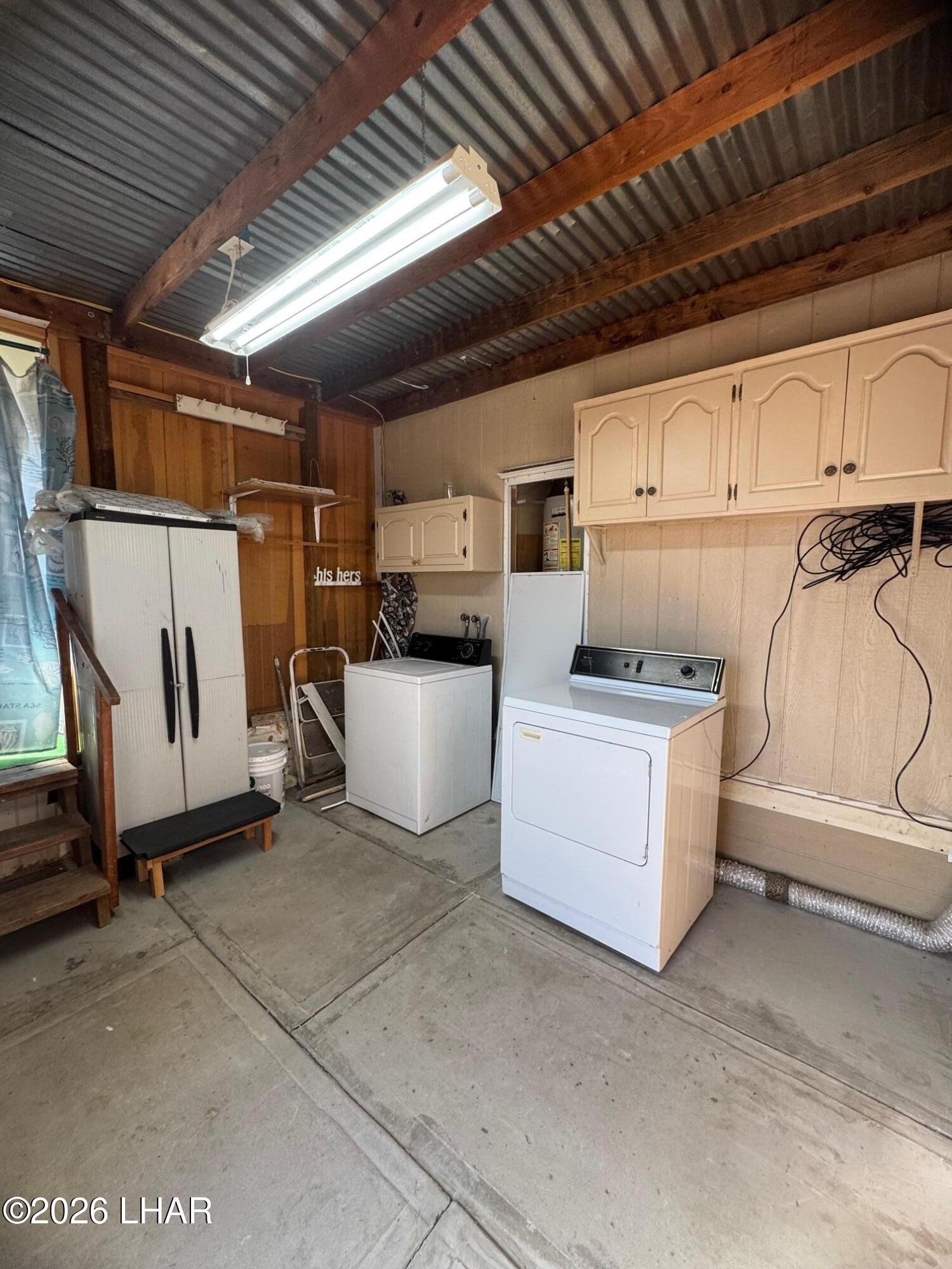 15454 Mohave Road Yucca, AZ 86438 - Photo 17 of 47 a utility room with dryer and washer