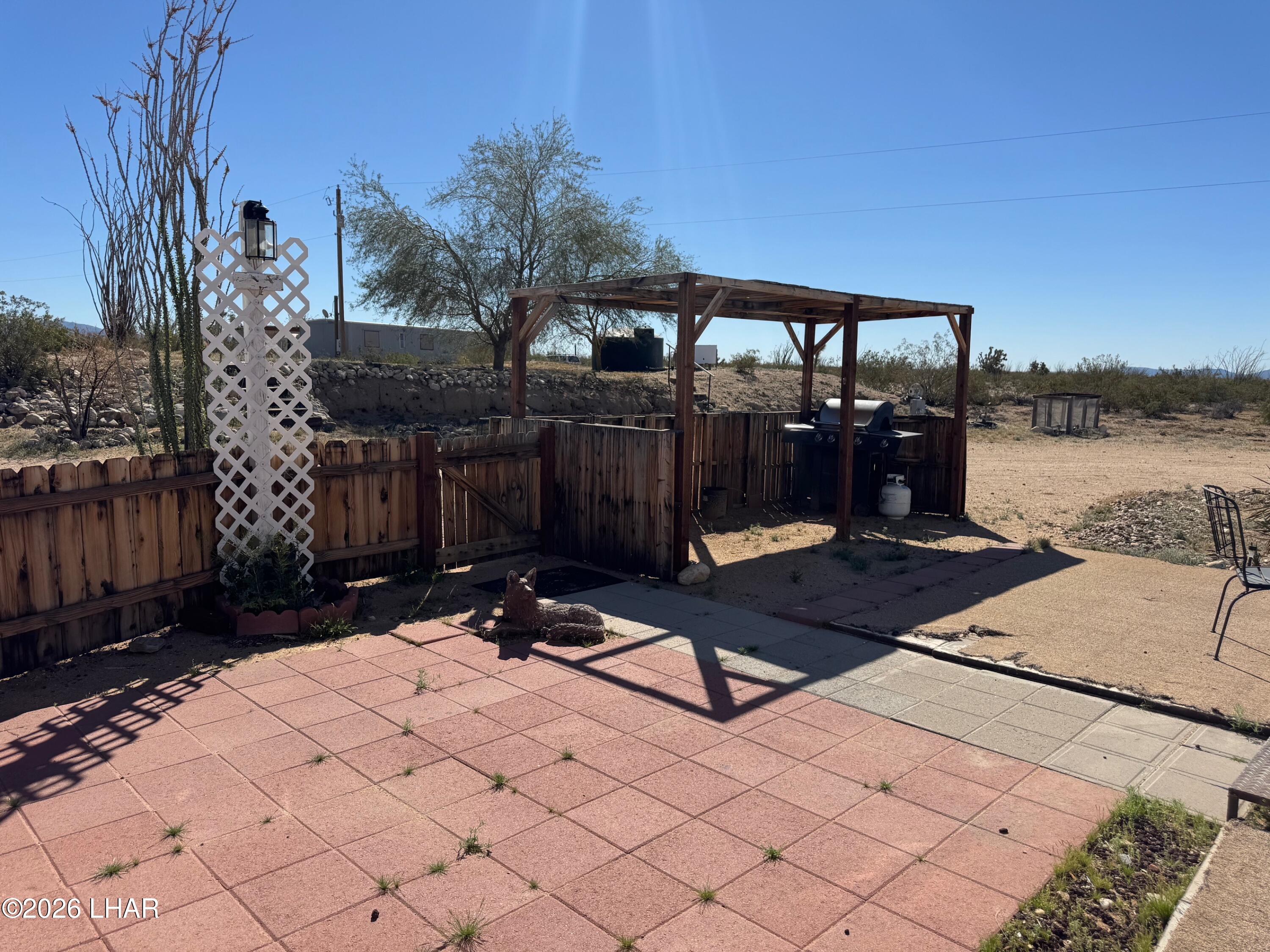15454 Mohave Road Yucca, AZ 86438 - Photo 30 of 47 a view of a terrace with a bench