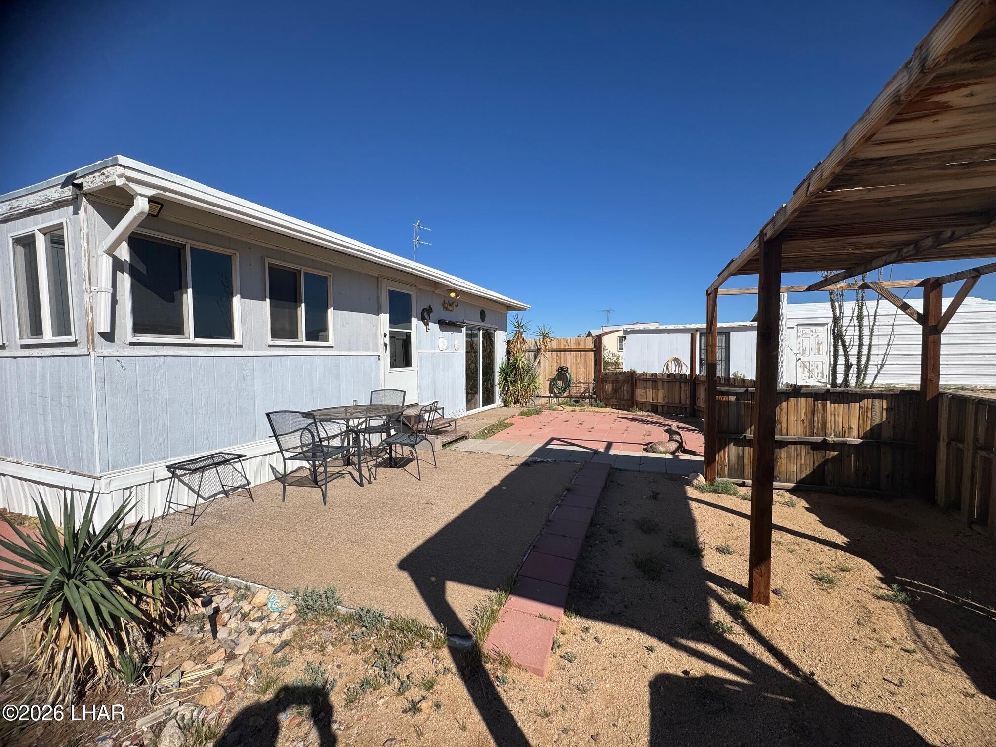 15454 Mohave Road Yucca, AZ 86438 - Photo 34 of 47 a view of a backyard with sitting area