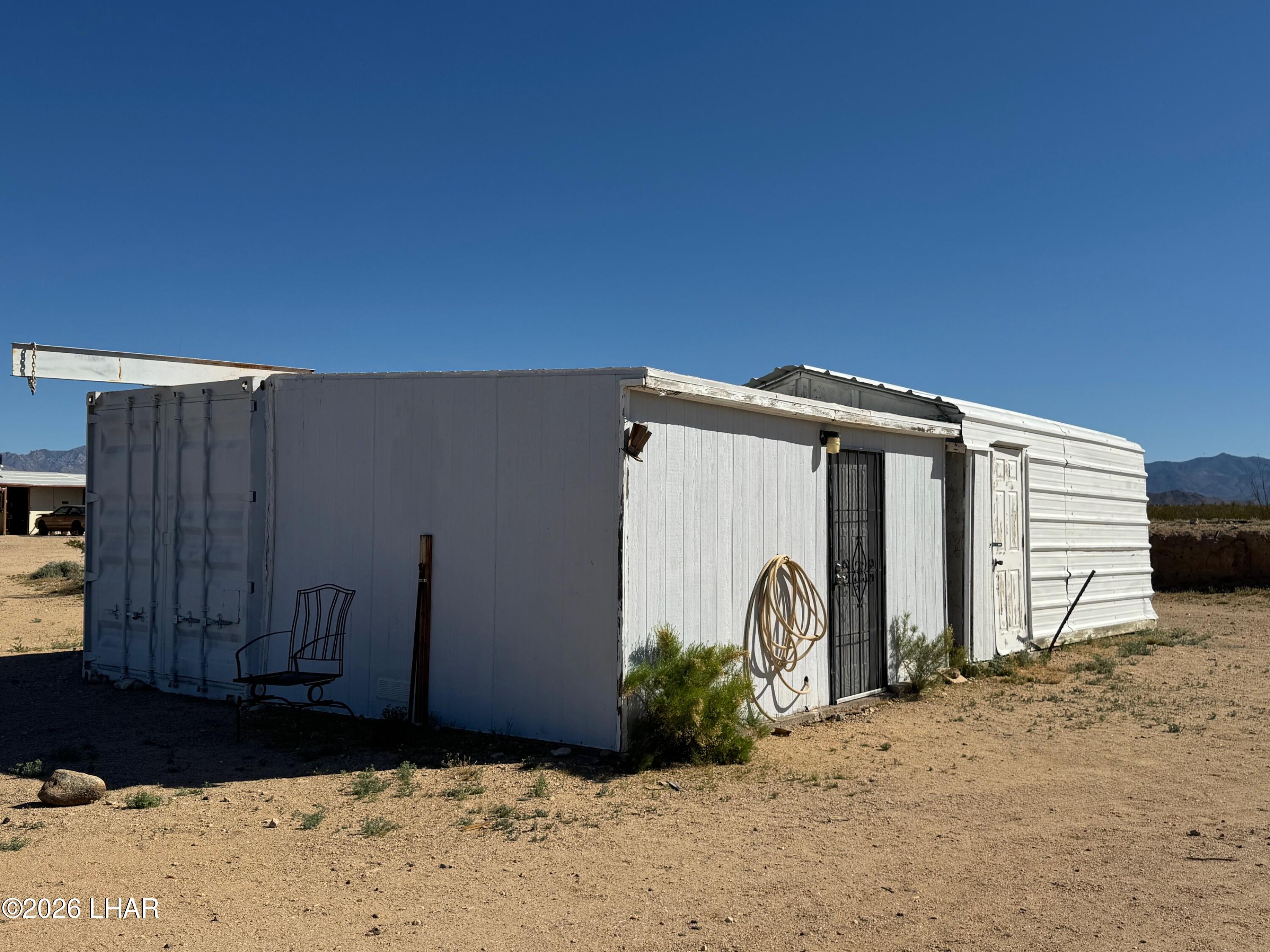 15454 Mohave Road Yucca, AZ 86438 - Photo 37 of 47 a view of front door and yard