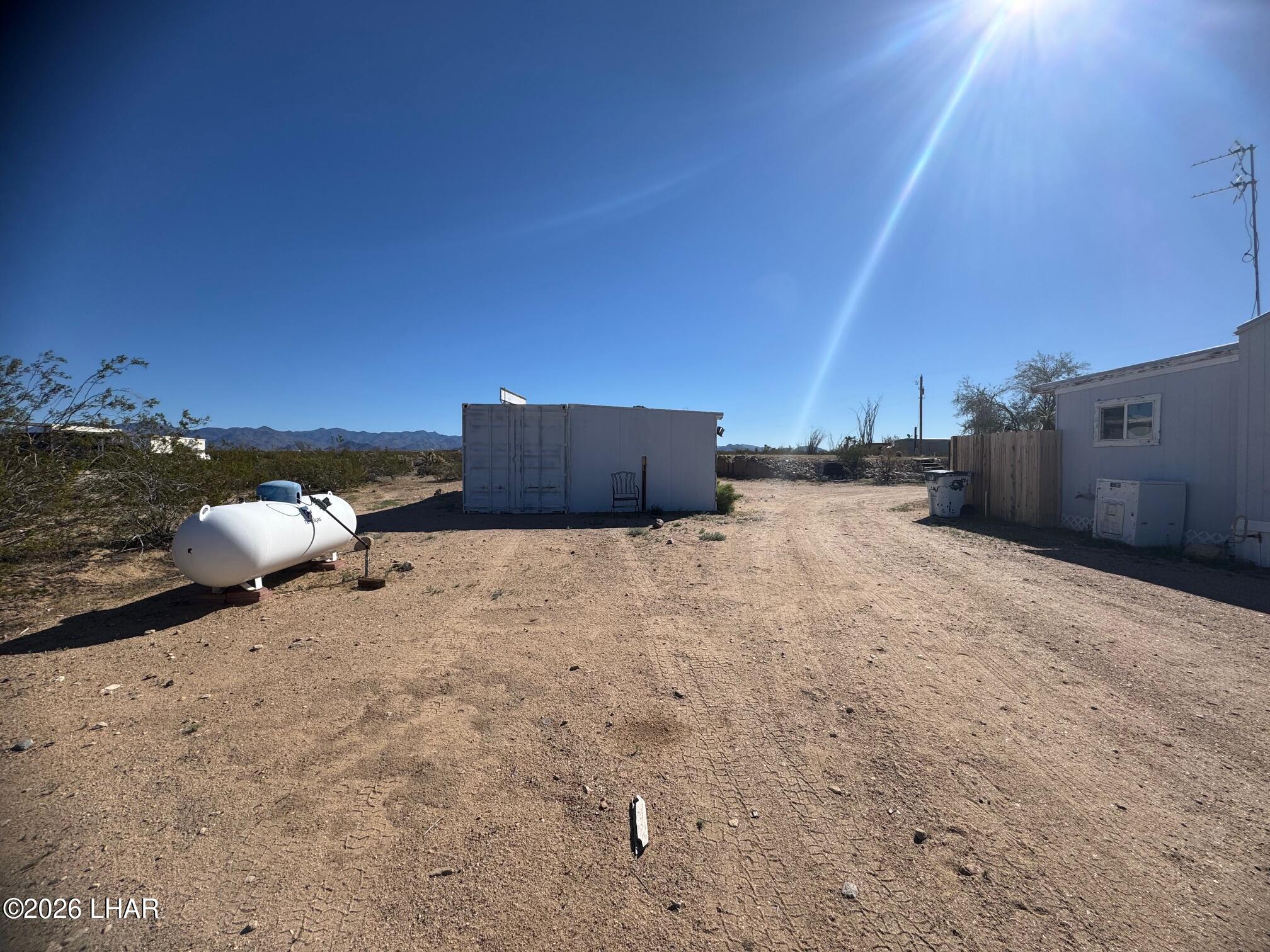 15454 Mohave Road Yucca, AZ 86438 - Photo 38 of 47 a view of a dry yard with a tree