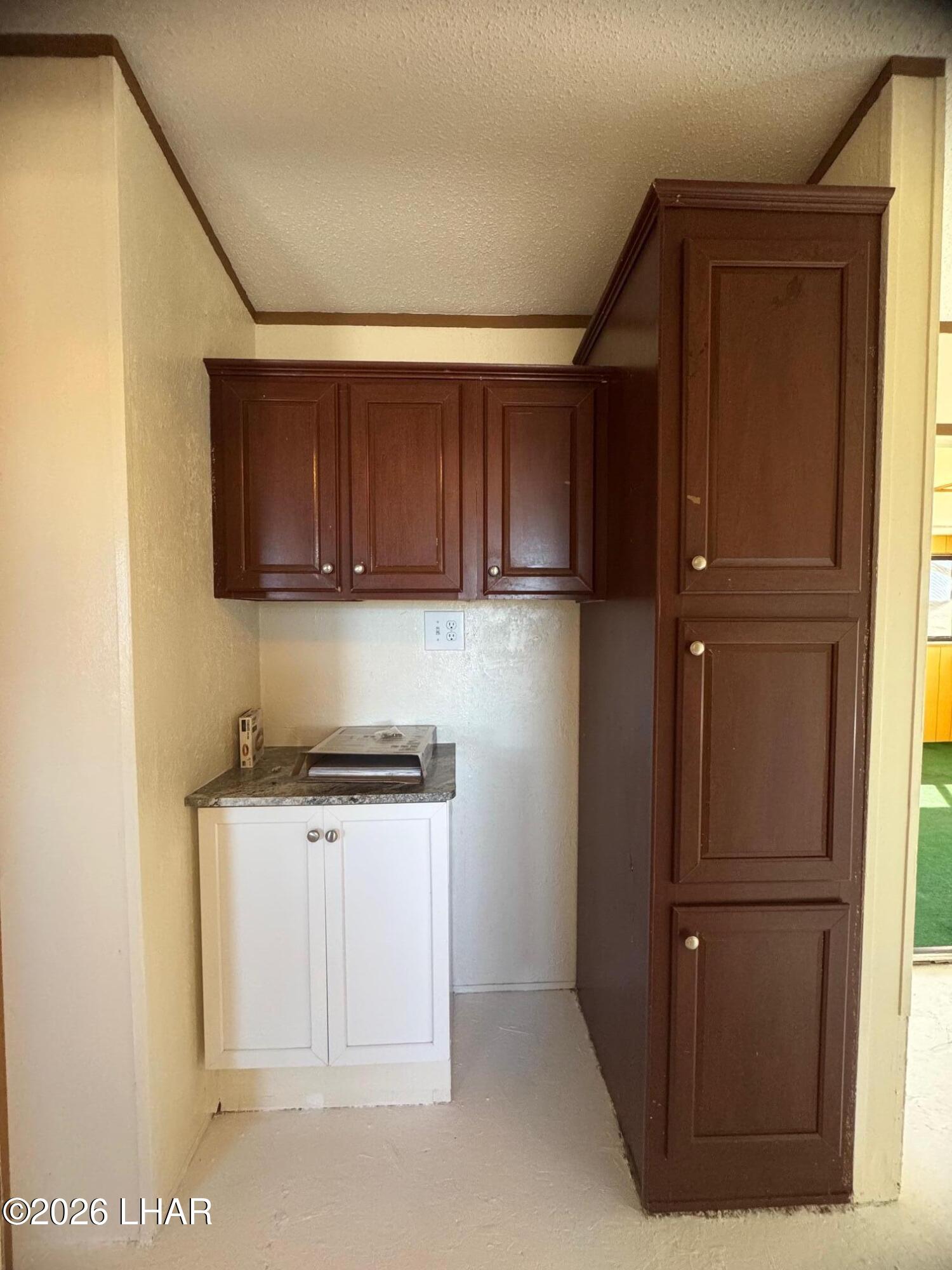 15454 Mohave Road Yucca, AZ 86438 - Photo 6 of 47 a kitchen with stainless steel appliances granite countertop a refrigerator and a stove top oven