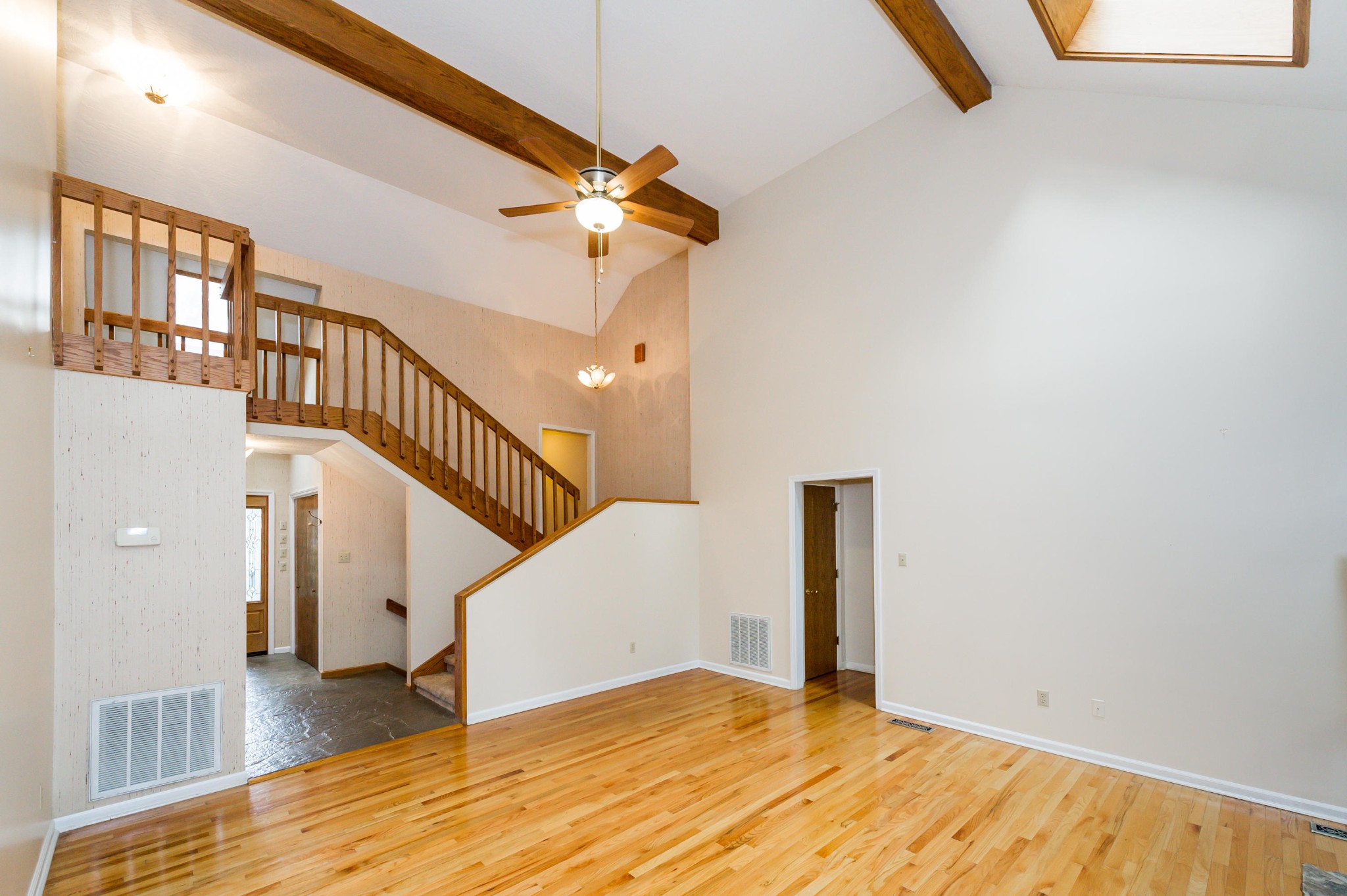 102 Clayton Way Oak Ridge, TN 37830 - Photo 16 of 40 a view of a livingroom with wooden floor and stairs