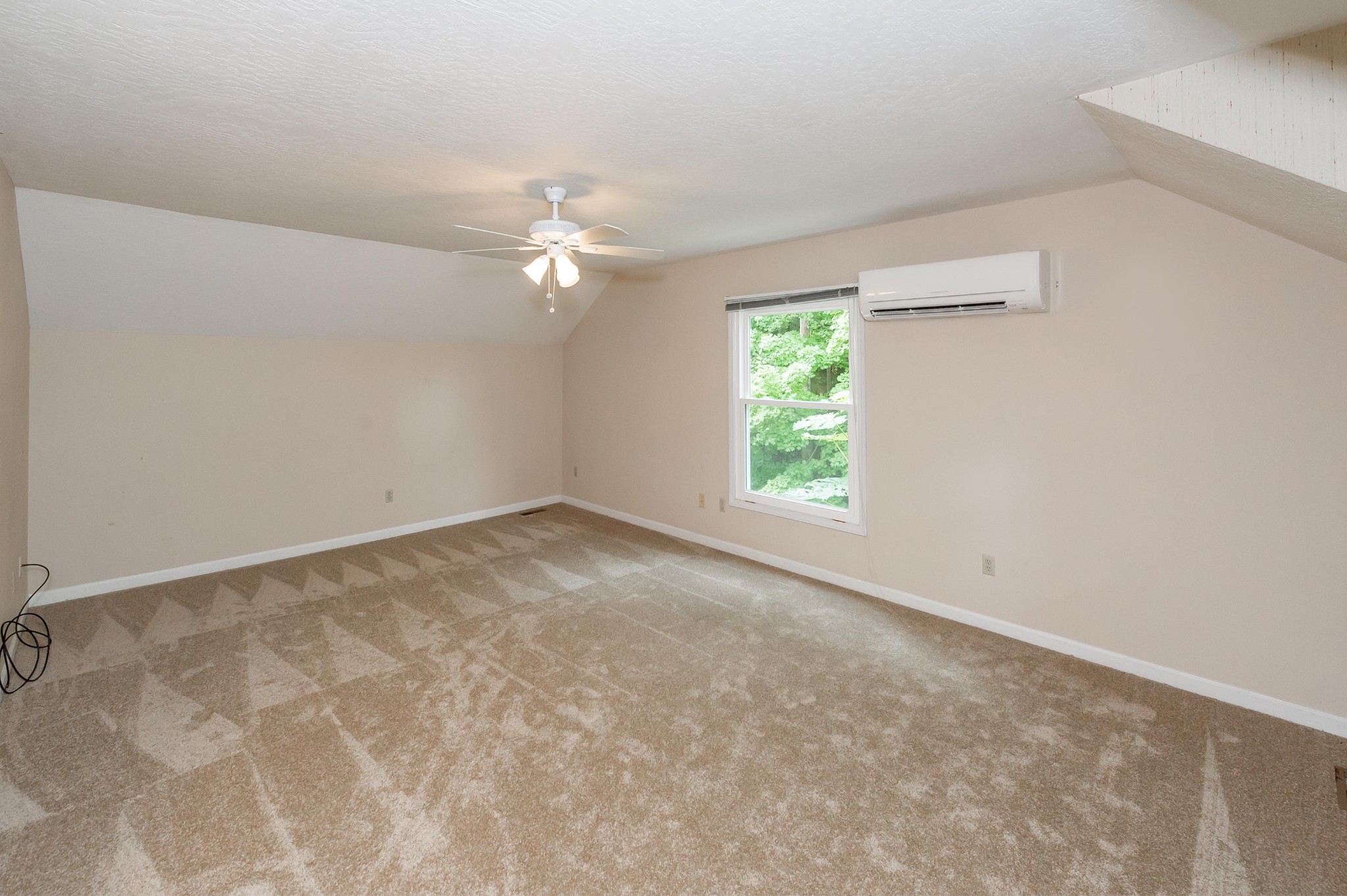 102 Clayton Way Oak Ridge, TN 37830 - Photo 20 of 40 an empty room with a window and a fan