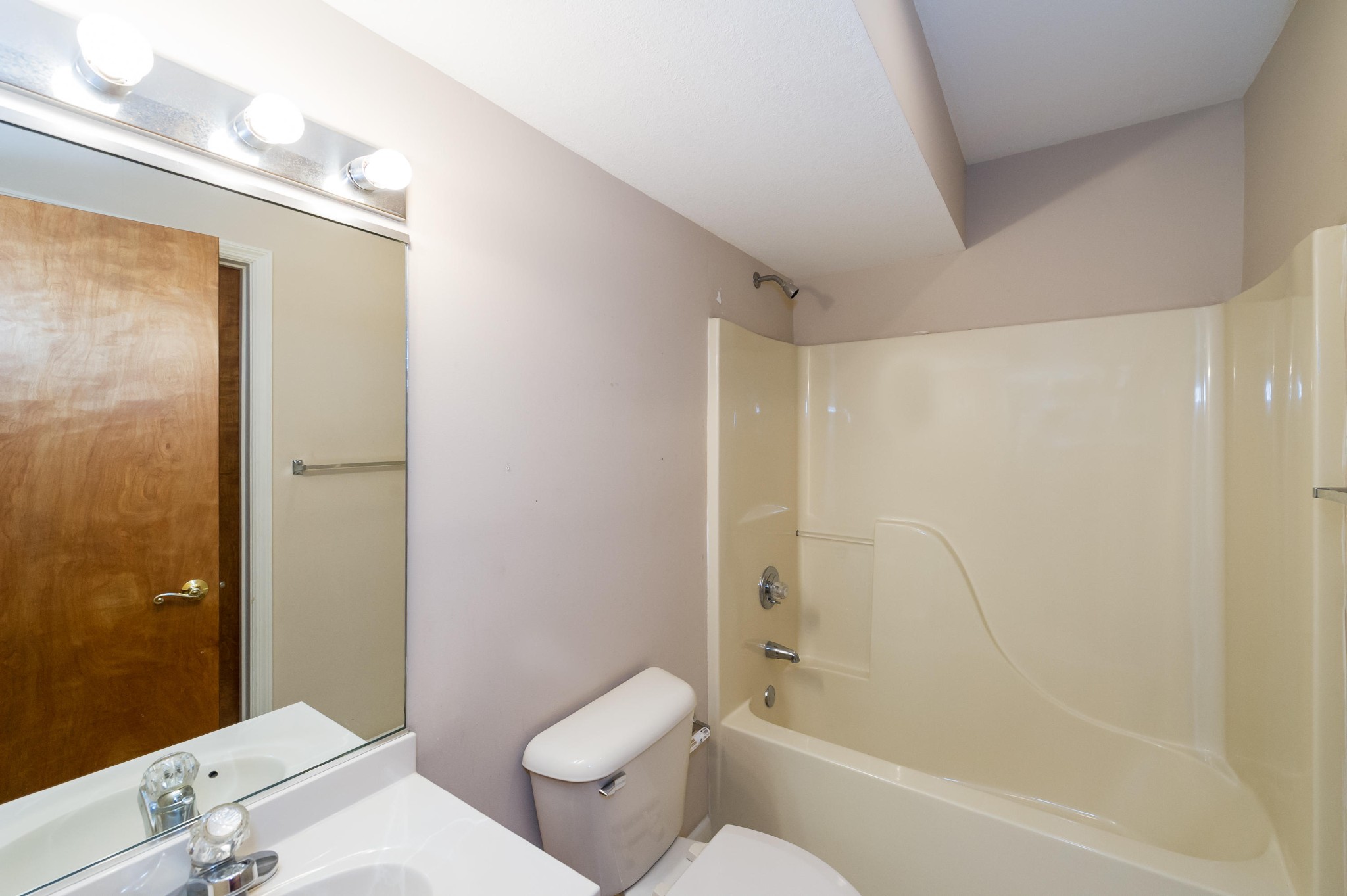 102 Clayton Way Oak Ridge, TN 37830 - Photo 24 of 40 a bathroom with a granite countertop bathtub shower sink vanity and toilet