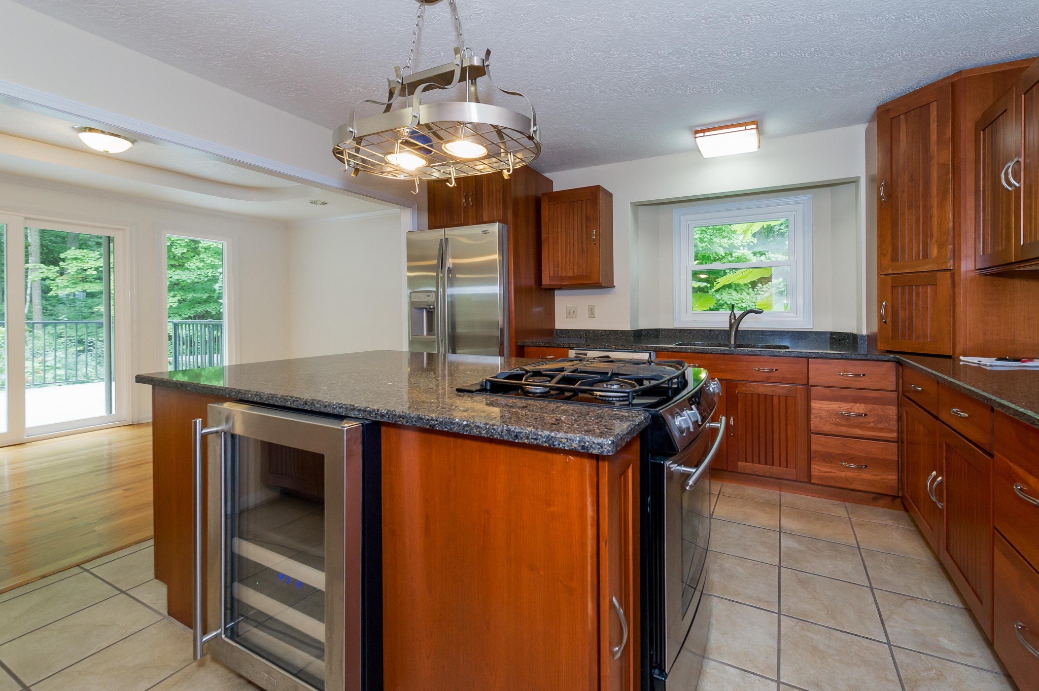 102 Clayton Way Oak Ridge, TN 37830 - Photo 32 of 40 a kitchen with stainless steel appliances granite countertop a stove a sink and a refrigerator