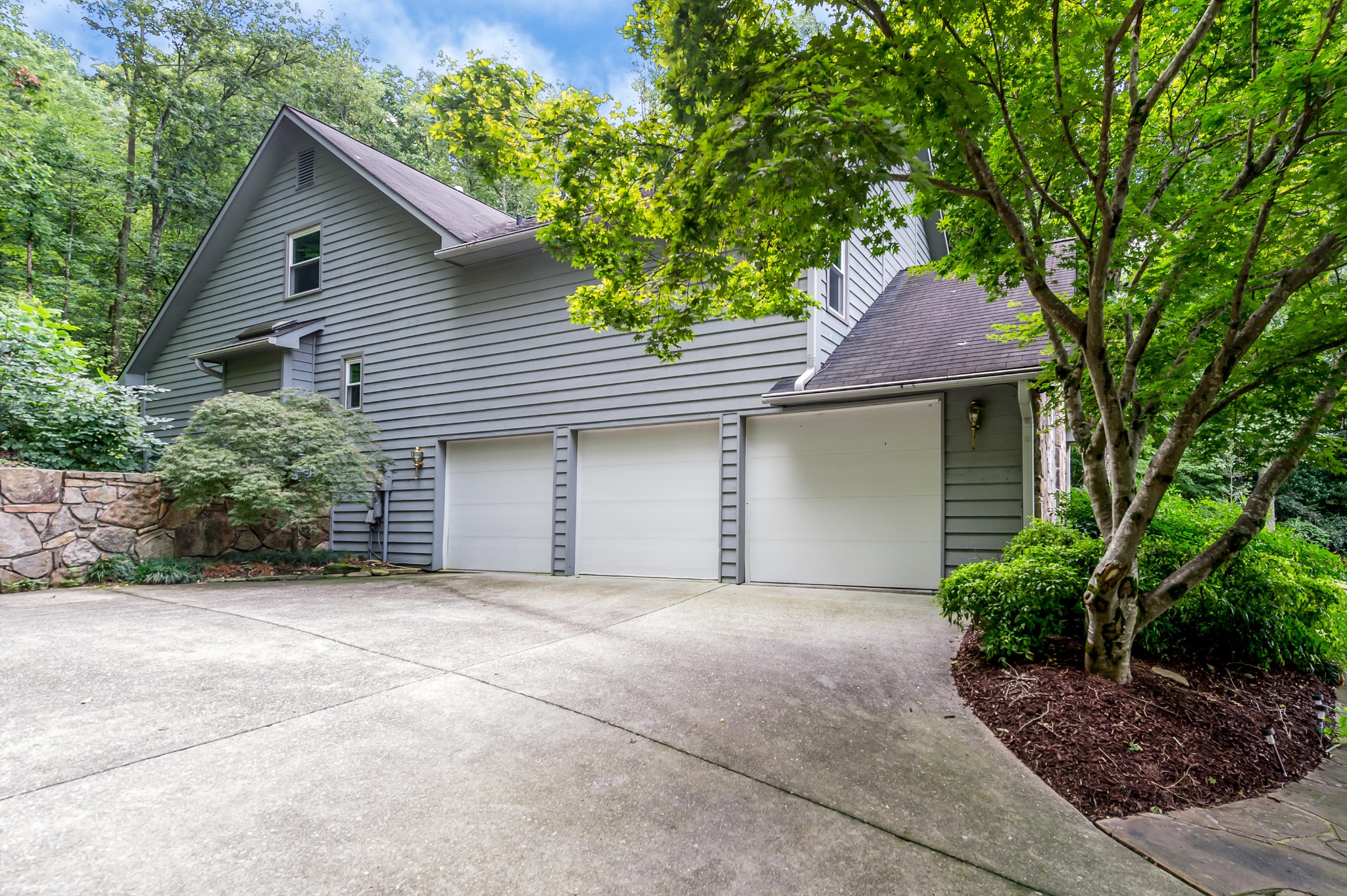 102 Clayton Way Oak Ridge, TN 37830 - Photo 35 of 40 a front view of a house with a garden and trees