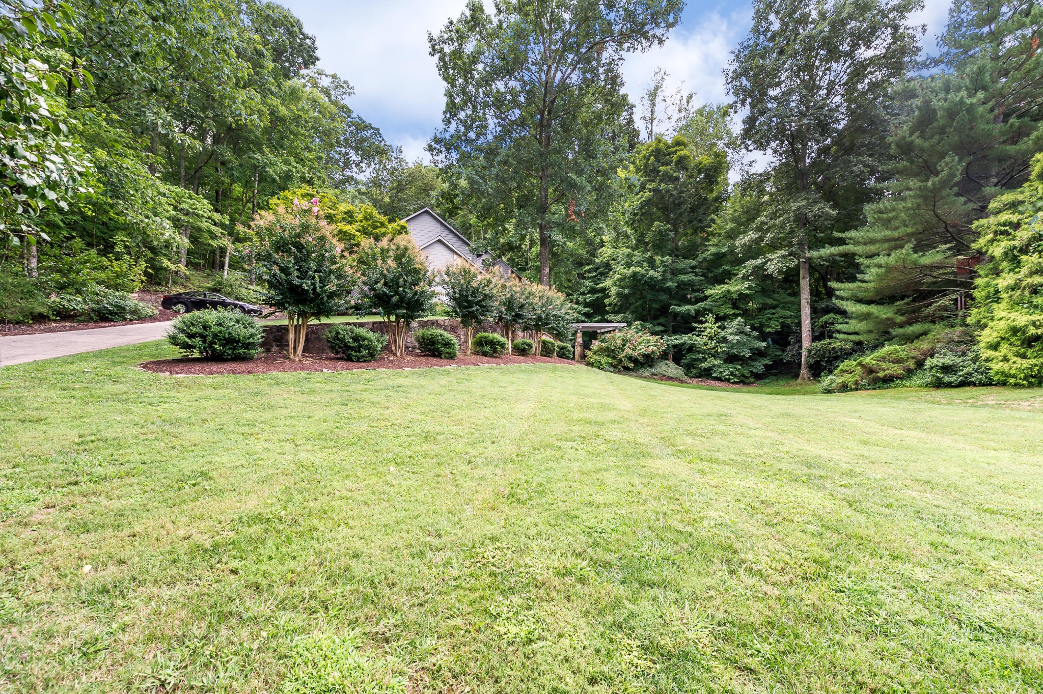 102 Clayton Way Oak Ridge, TN 37830 - Photo 36 of 40 a view of a backyard with a garden