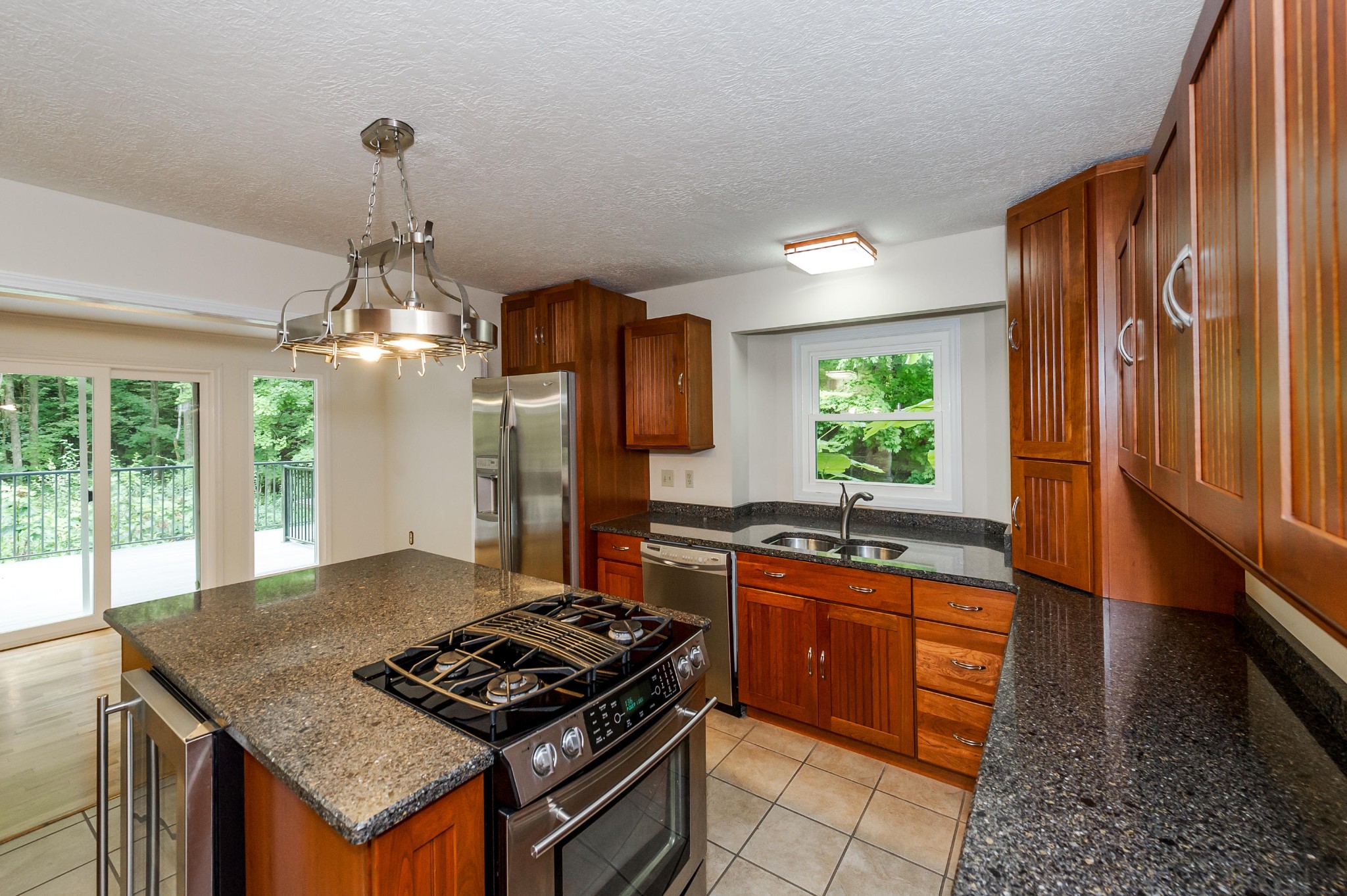 102 Clayton Way Oak Ridge, TN 37830 - Photo 5 of 40 a kitchen with stainless steel appliances granite countertop a stove a sink dishwasher and a refrigerator