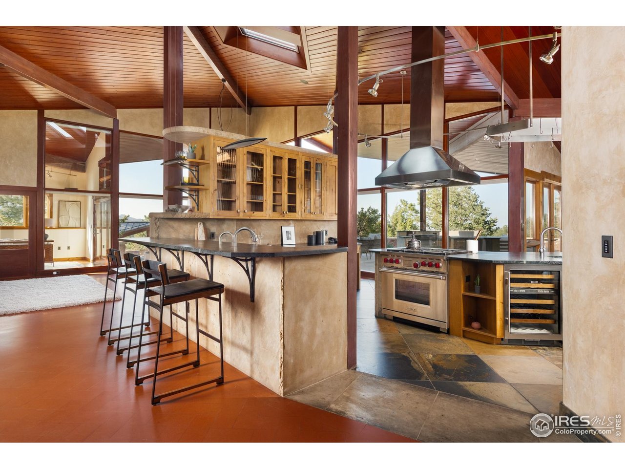 1530 Timber Lane Boulder, CO 80304 - Photo 11 of 50 a kitchen with stainless steel appliances kitchen island granite countertop a stove and cabinets