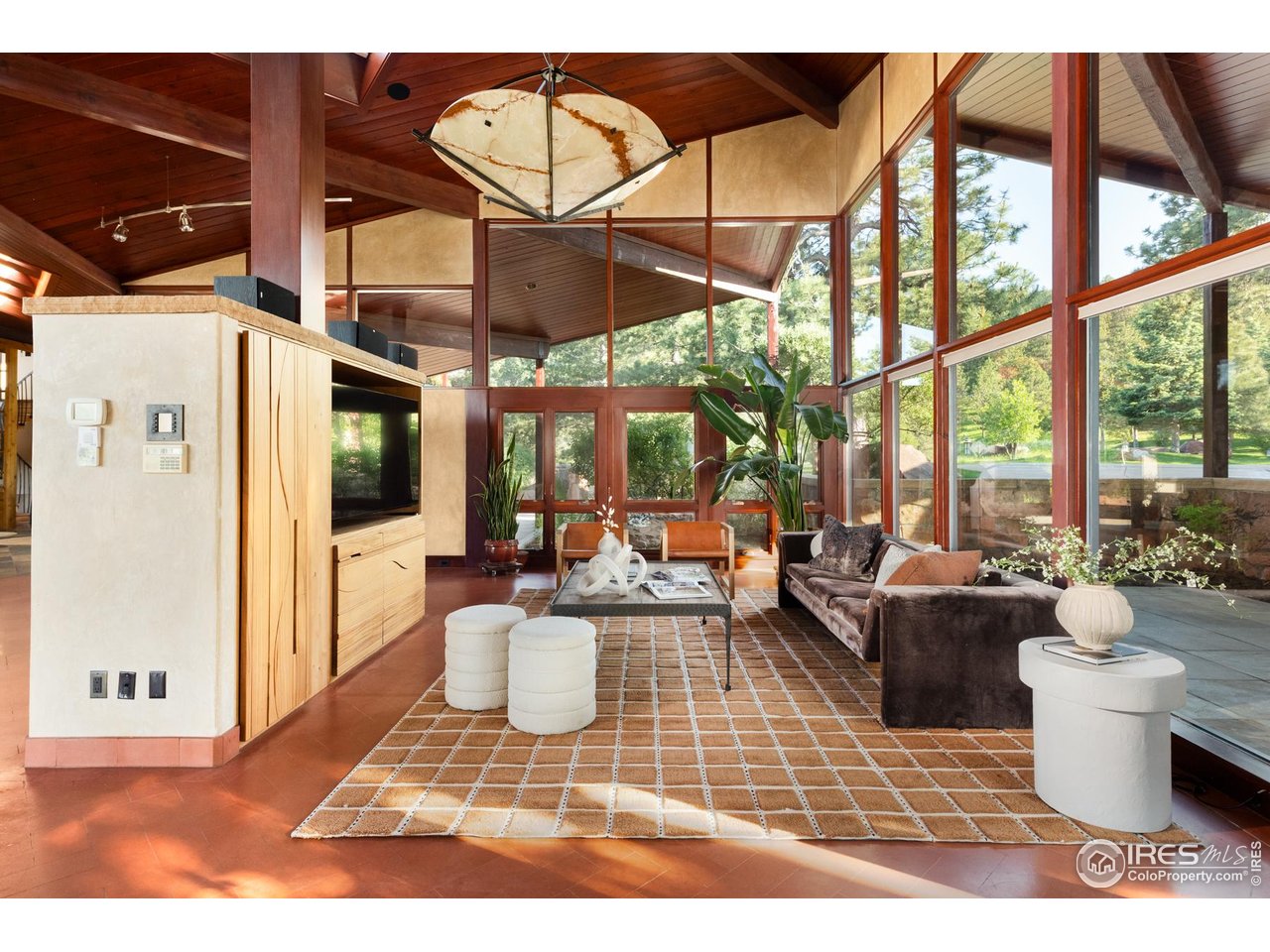 1530 Timber Lane Boulder, CO 80304 - Photo 17 of 50 a living room with furniture a large window and stainless steel appliances