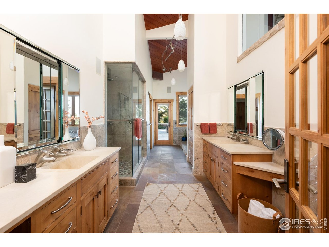 1530 Timber Lane Boulder, CO 80304 - Photo 22 of 50 a bathroom with a sink double vanity granite and a large mirror