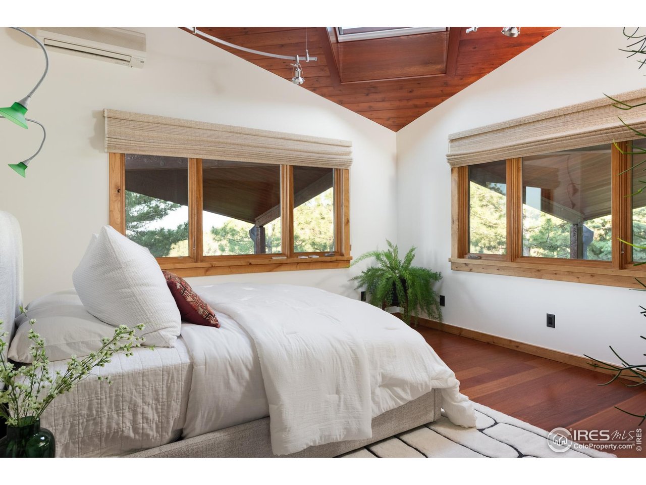 1530 Timber Lane Boulder, CO 80304 - Photo 25 of 50 a bedroom with a large bed and a large window