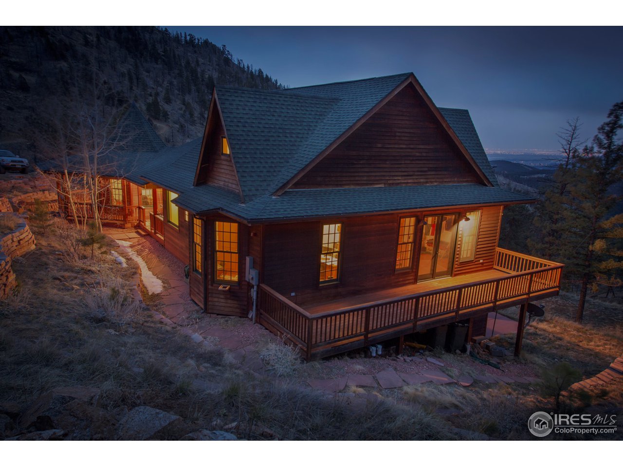 1689 County Road 83 Boulder, CO 80302 - Photo 1 of 17 a wooden bench sitting in backside of a building