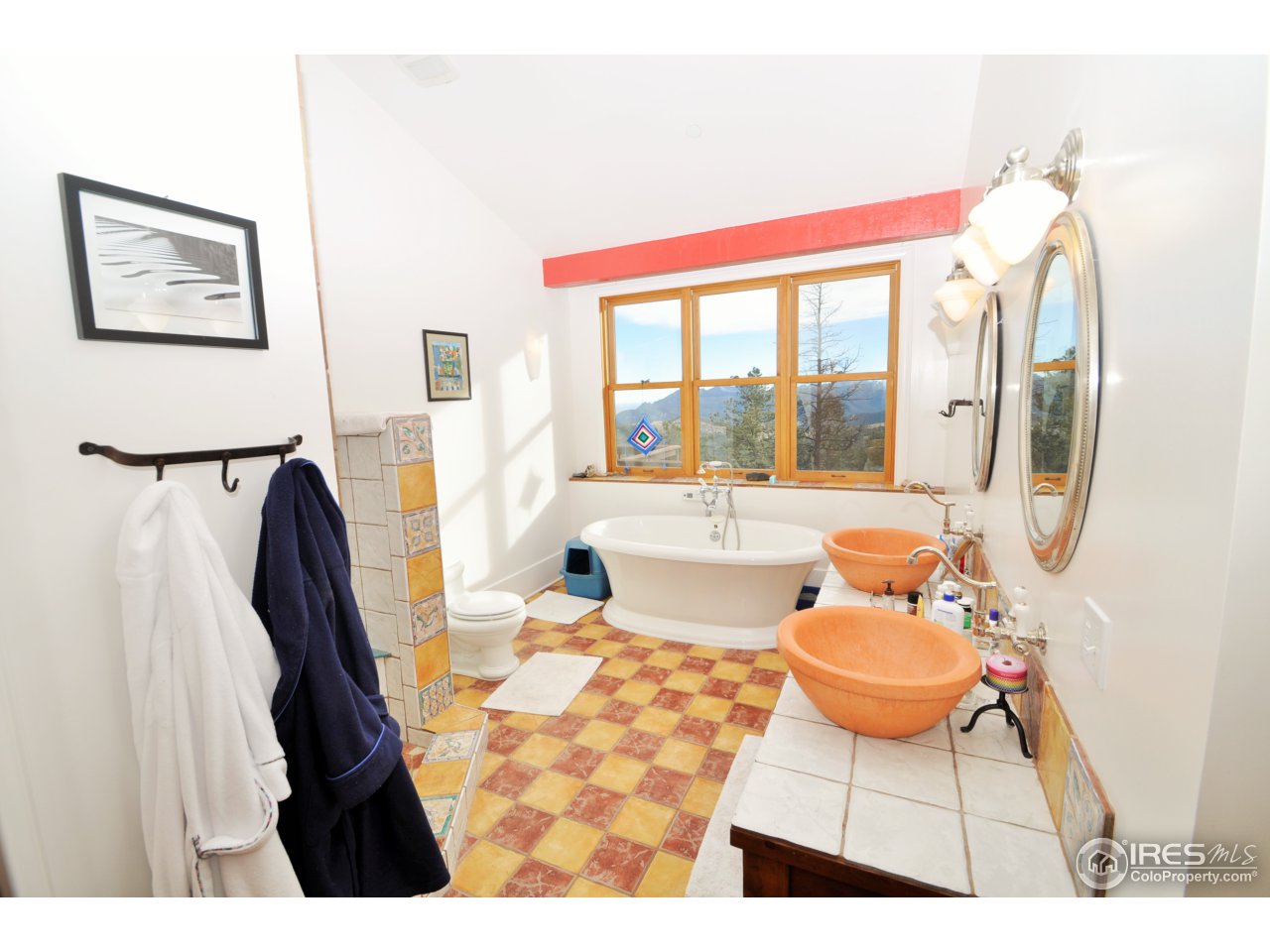 1689 County Road 83 Boulder, CO 80302 - Photo 12 of 17 a living room with furniture a rug and a chandelier