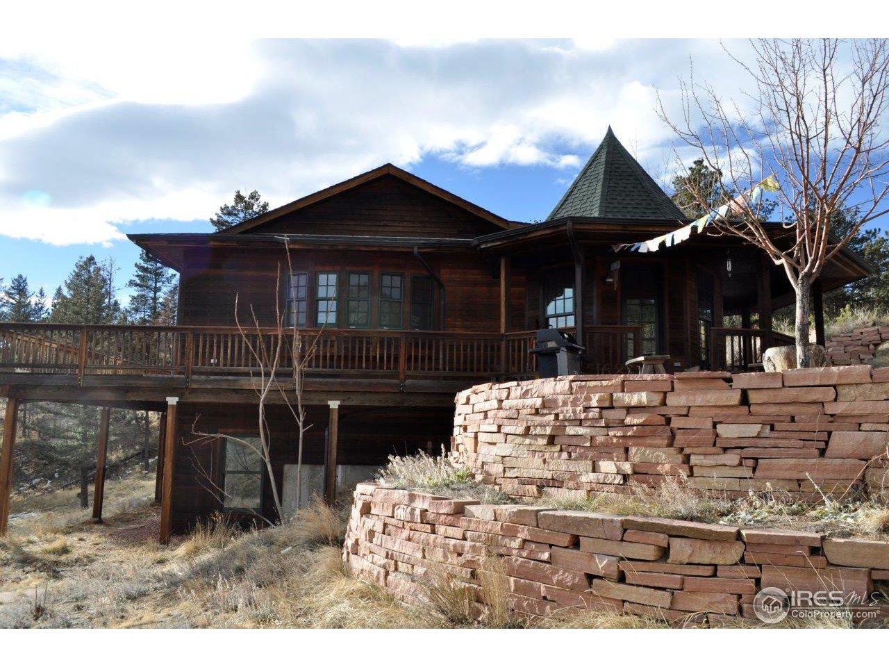 1689 County Road 83 Boulder, CO 80302 - Photo 16 of 17 a front view of a house with a yard