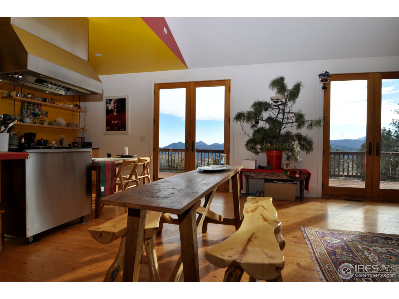 1689 County Road 83 Boulder, CO 80302 - Photo 2 of 17 a view of a dining room with furniture and a potted plant
