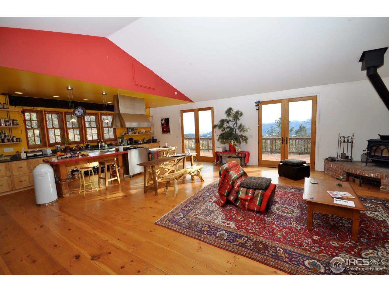 1689 County Road 83 Boulder, CO 80302 - Photo 3 of 17 a living room with furniture a rug and a floor to ceiling window