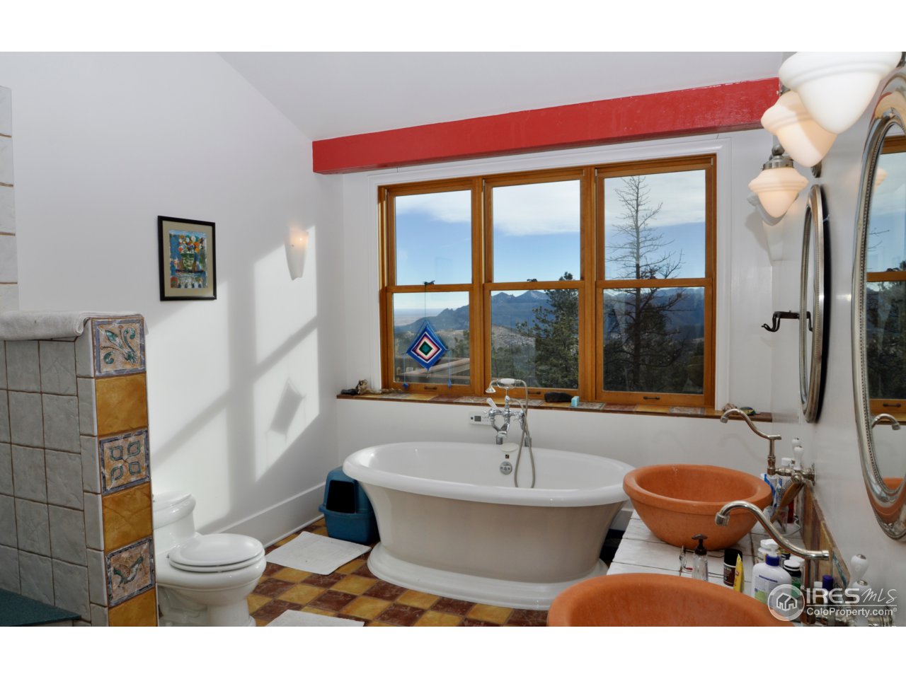 1689 County Road 83 Boulder, CO 80302 - Photo 5 of 17 a bathroom with a sink and a large mirror