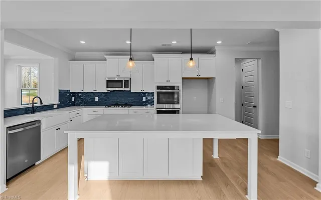 $600,000 | 8607 Lemur Lane, Summerfield, NC 27358