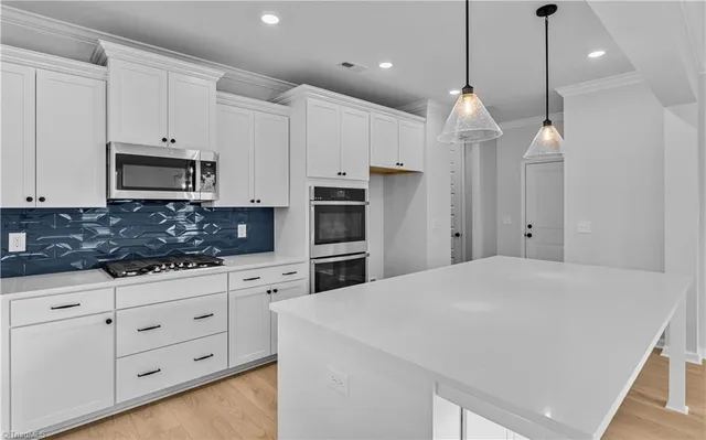 $600,000 | 8607 Lemur Lane, Summerfield, NC 27358