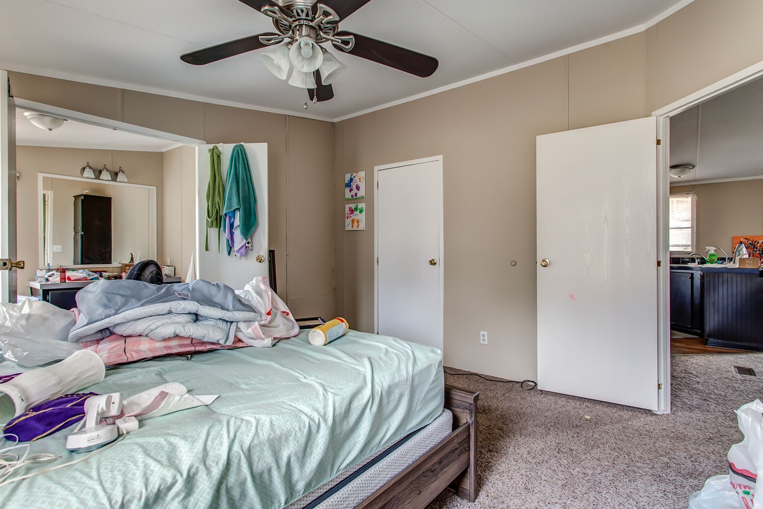 5655 South Commerce Road Watertown, TN 37184 - Photo 13 of 21 a bedroom with a bed and a chandelier