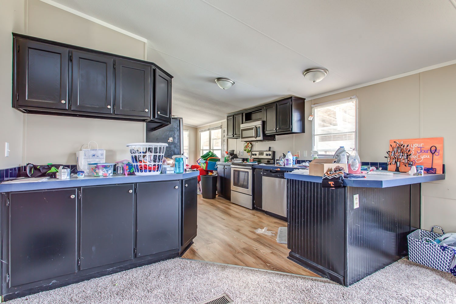 5655 South Commerce Road Watertown, TN 37184 - Photo 7 of 21 a kitchen with stainless steel appliances granite countertop a sink dishwasher stove and cabinets