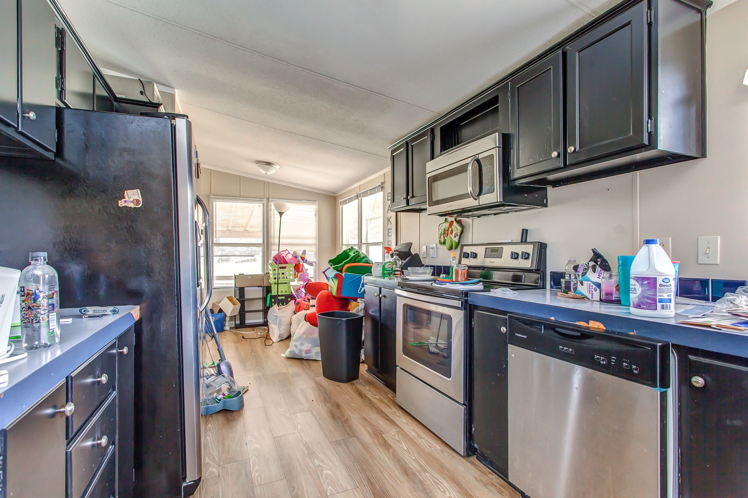 5655 South Commerce Road Watertown, TN 37184 - Photo 8 of 21 a kitchen with stainless steel appliances granite countertop a sink dishwasher stove and cabinets
