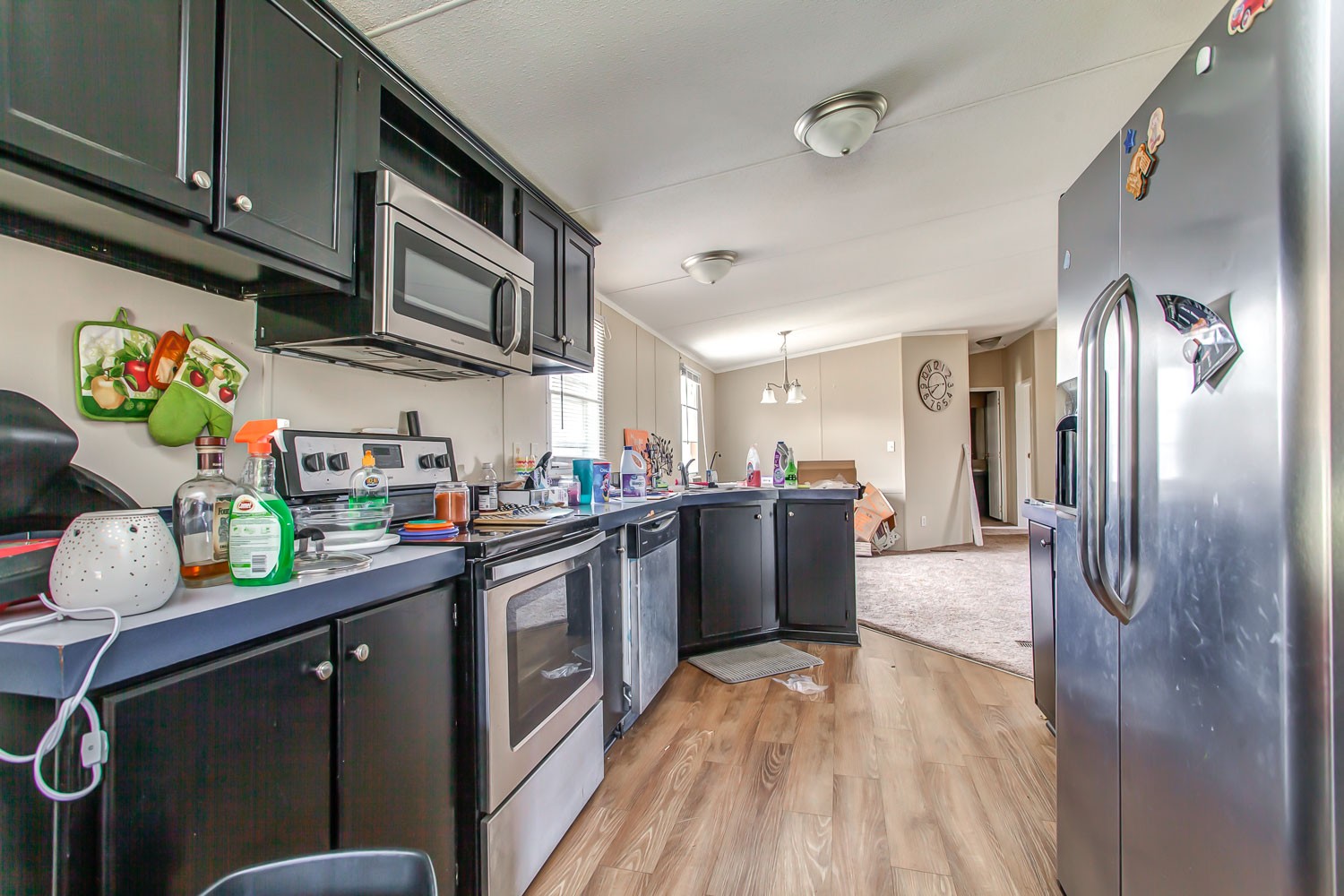 5655 South Commerce Road Watertown, TN 37184 - Photo 9 of 21 a kitchen with stainless steel appliances granite countertop a refrigerator a sink dishwasher and a stove with wooden floor