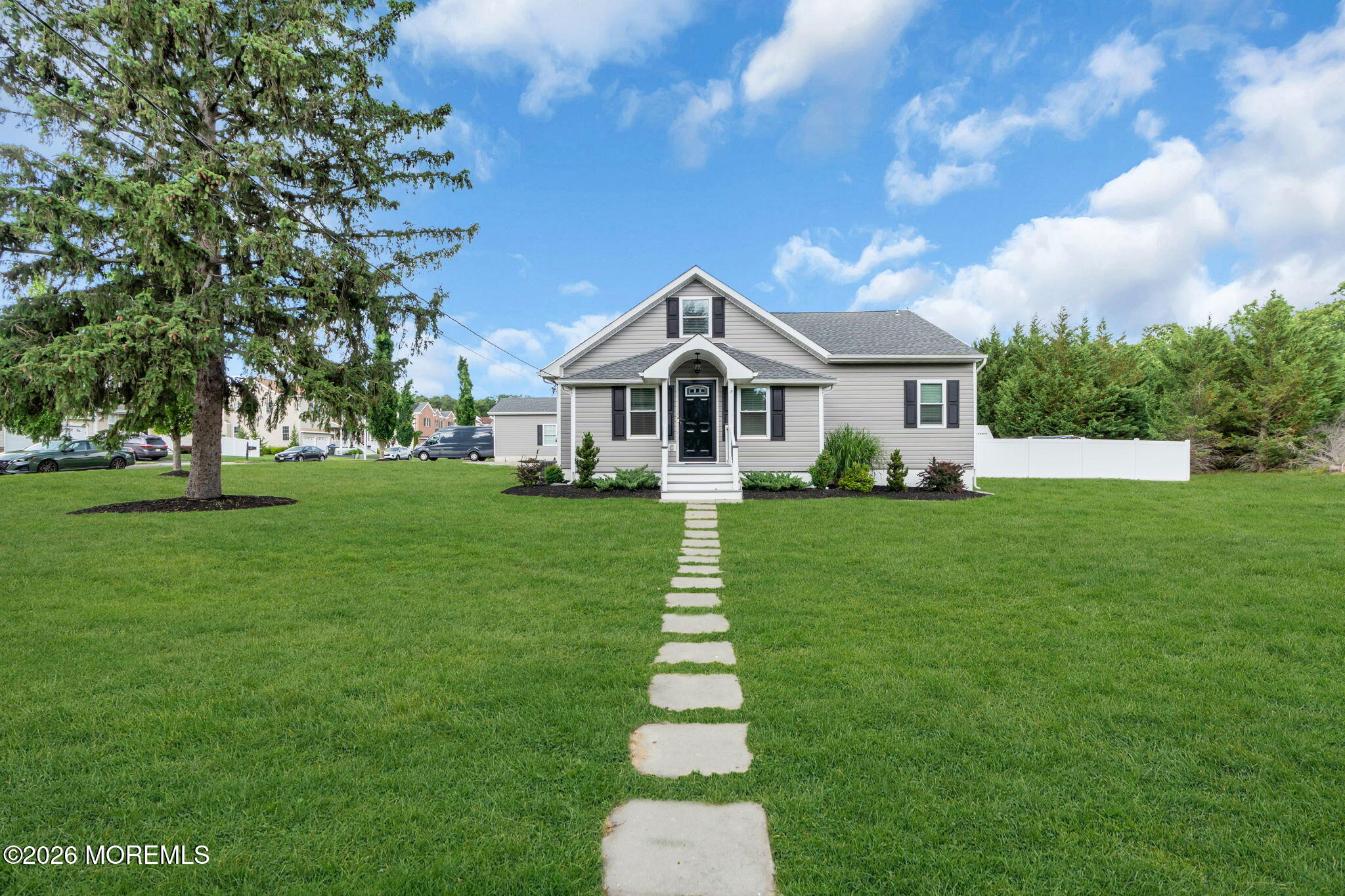 181 Locust Avenue Howell, NJ 07731 - Photo 6 of 66 a front view of a house with a yard