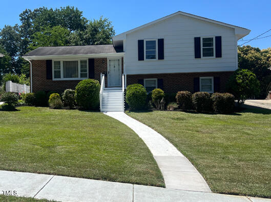 1517 Westchester Road Raleigh, NC 27610 - Photo 1 of 13 a house view with a garden space