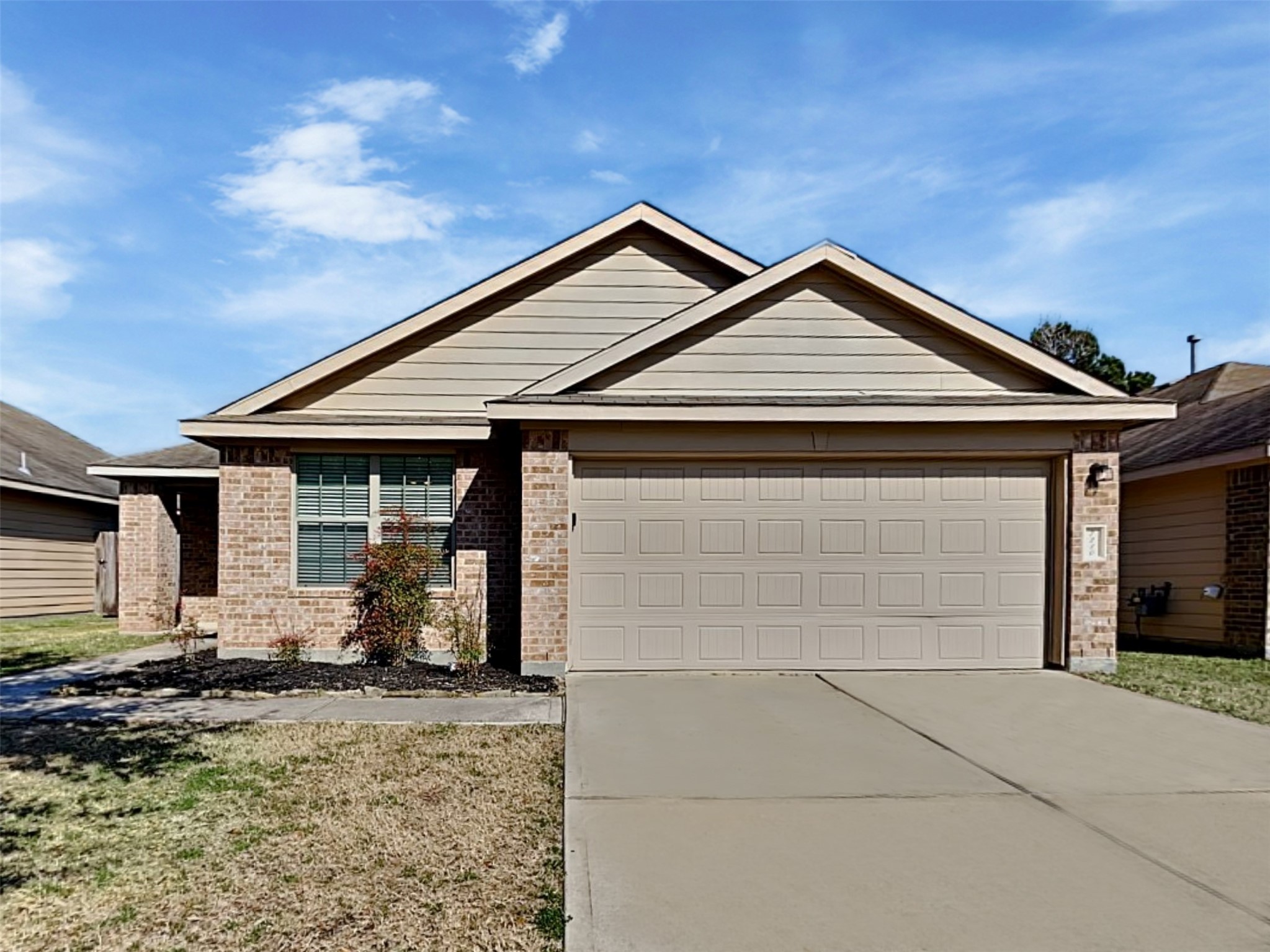 a front view of a house with parking space