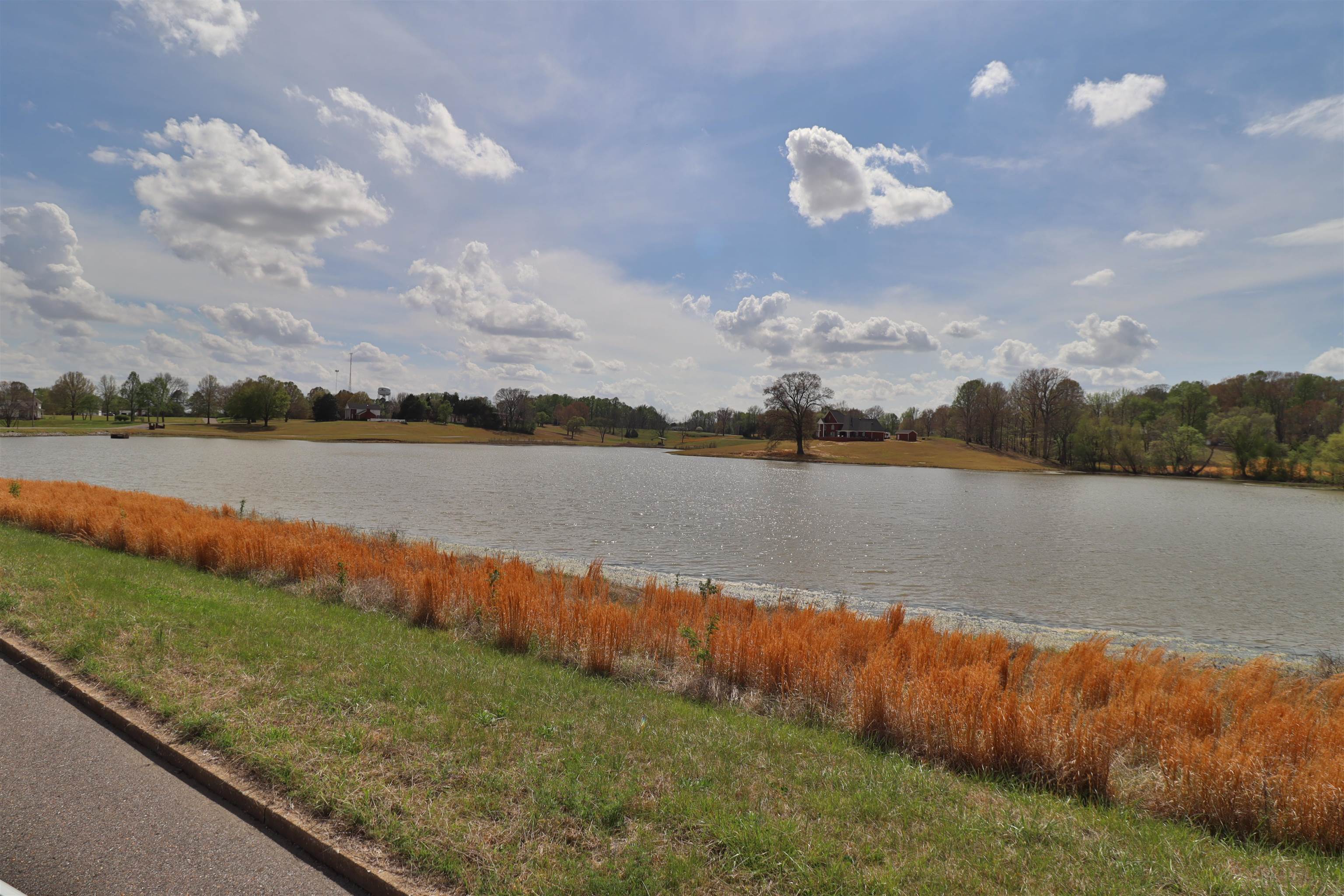 0 Hunters Trace Drive Ripley, TN 38063 - Photo 24 of 33 a view of a lake with houses in the back