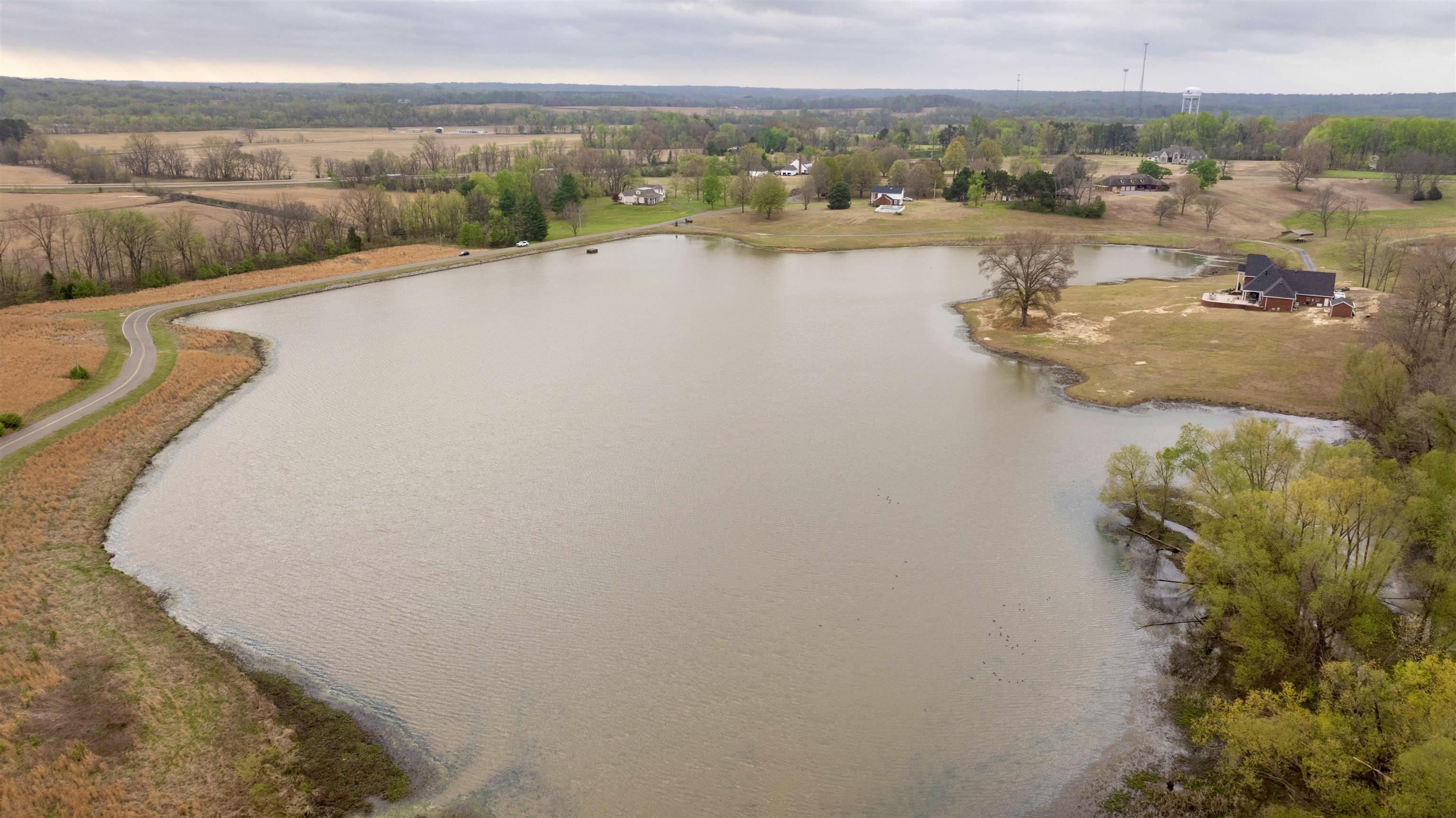 0 Hunters Trace Drive Ripley, TN 38063 - Photo 25 of 33 a view of a lake with a mountain in the background