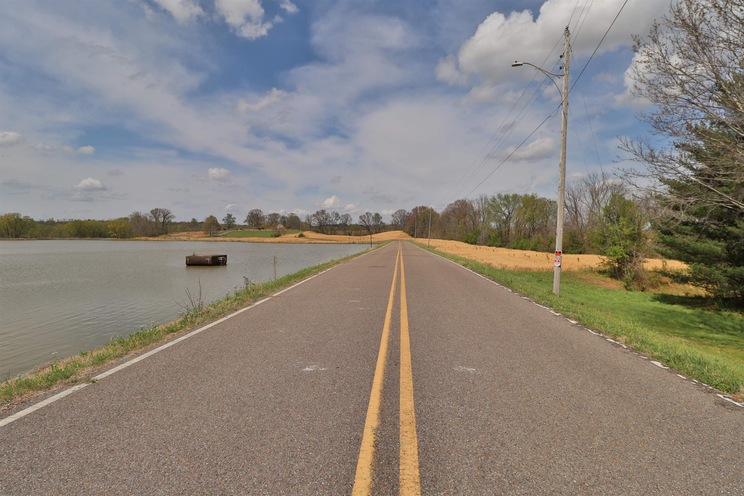 0 Hunters Trace Drive Ripley, TN 38063 - Photo 4 of 33 a view of a lake with a city from a balcony